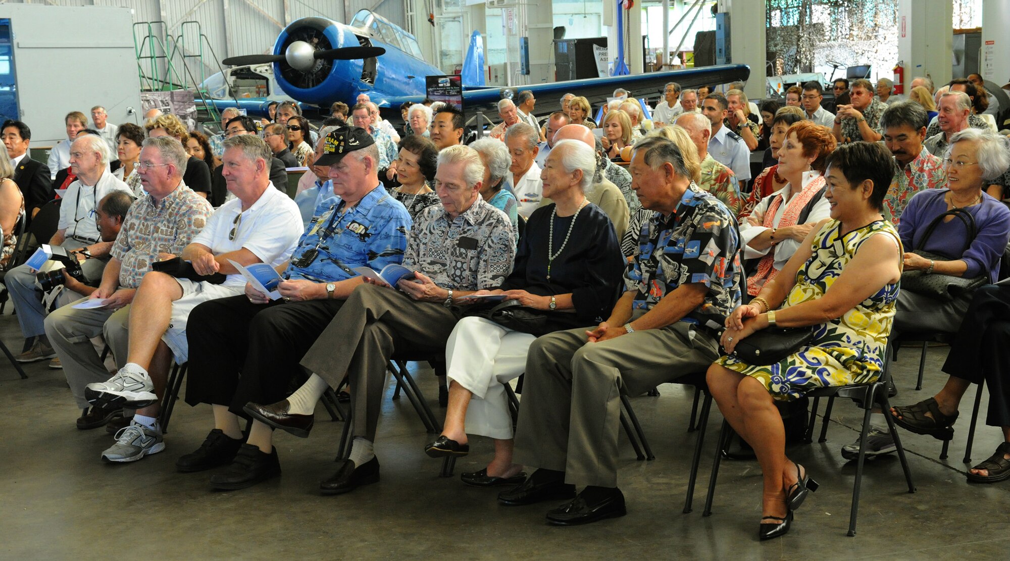 Attendees of the Republic of Korea Air Force F-5A Freedom Fighter dedication ceremony listen attentively during the ROKAF recognition acknowledgement presided over by Lt. Gen. Cha-Kyu Choi, ROKAF Vice Chief of Staff, at the Pacific Aviation Museum, Ford Island, Nov. 12, 2012. The attendees included Korean War veterans, business and civic leaders, and U.S. military leaders. (U.S. Air Force photo/Tech Sgt. Jerome S. Tayborn/Released)