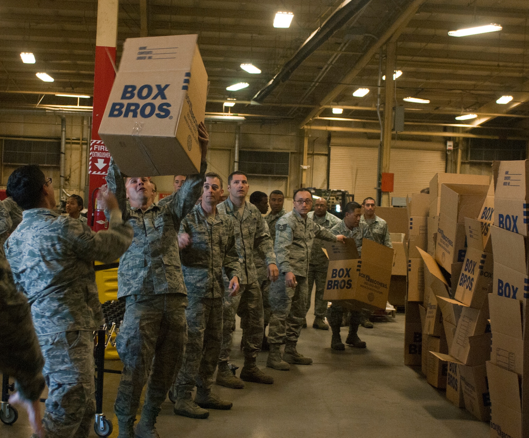 Airmen help move food items donated by the Tug Boat association for Operation Warm Heart Nov. 13, 2012, at Nellis Air Force Base, Nev. Operation Warm Heart donates Thanksgiving dinners to Nellis and Creech AFB families. This year, with the help of the Tug Boat Association, Operation Warm Heart donated 700 Thanksgiving meals. (U.S. Air Force photo by Senior Airman Jack Sanders)