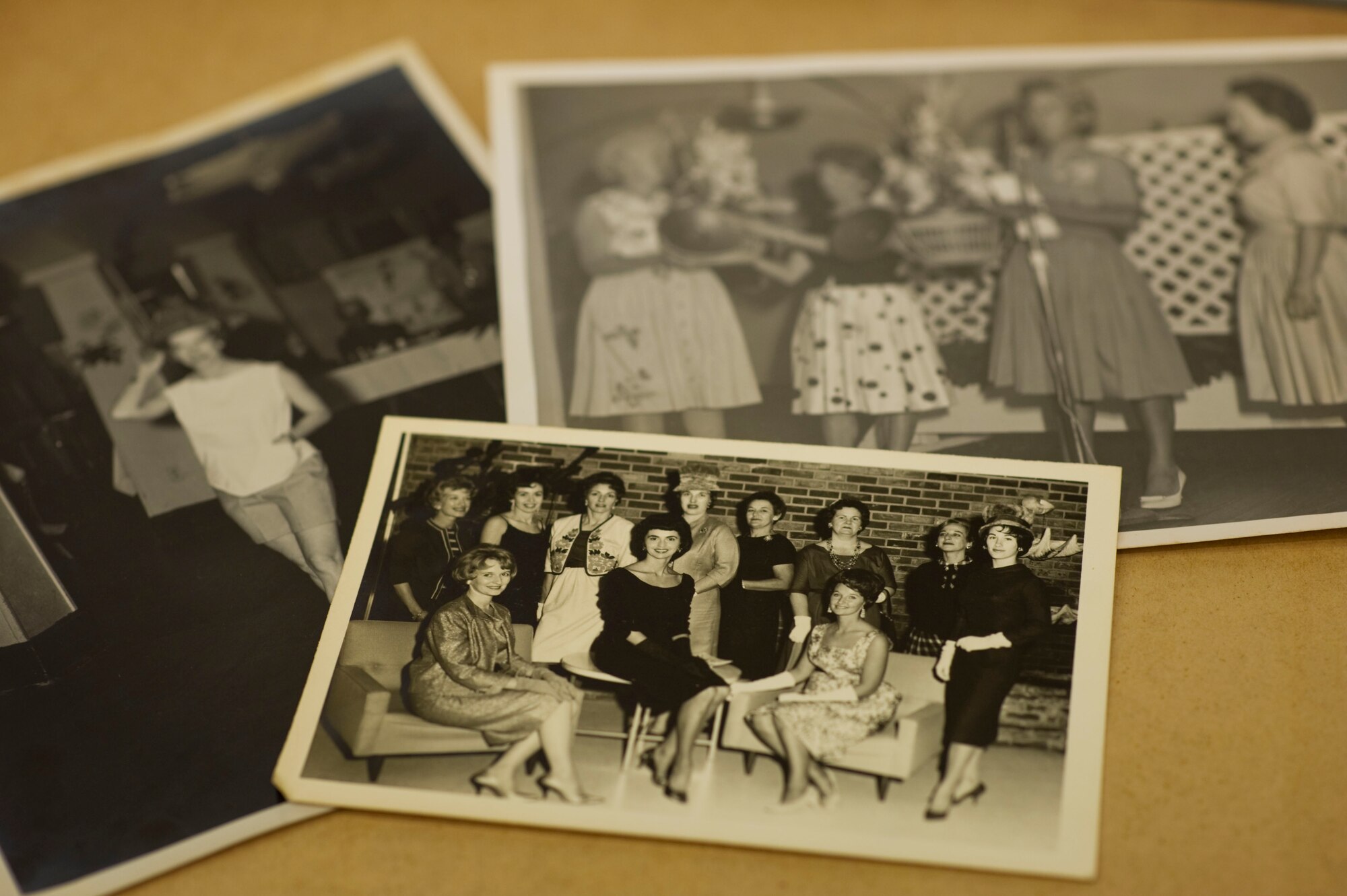 A page of the Hurlburt Spouse’s Club scrapbook from 1961 showcased during the HSC 50th anniversary celebration luncheon held at the Soundside Club, Hurlburt Field Fla., Nov. 15, 2012. The luncheon featured a military etiquette presentation by the 1st Special Operations protocol office, 50 years of photo scrapbooks and a then and now fashion show featuring nostalgic pieces and modern thrift store clothing. (U.S. Air Force photo by Tech. Sgt. Vanessa Valentine)