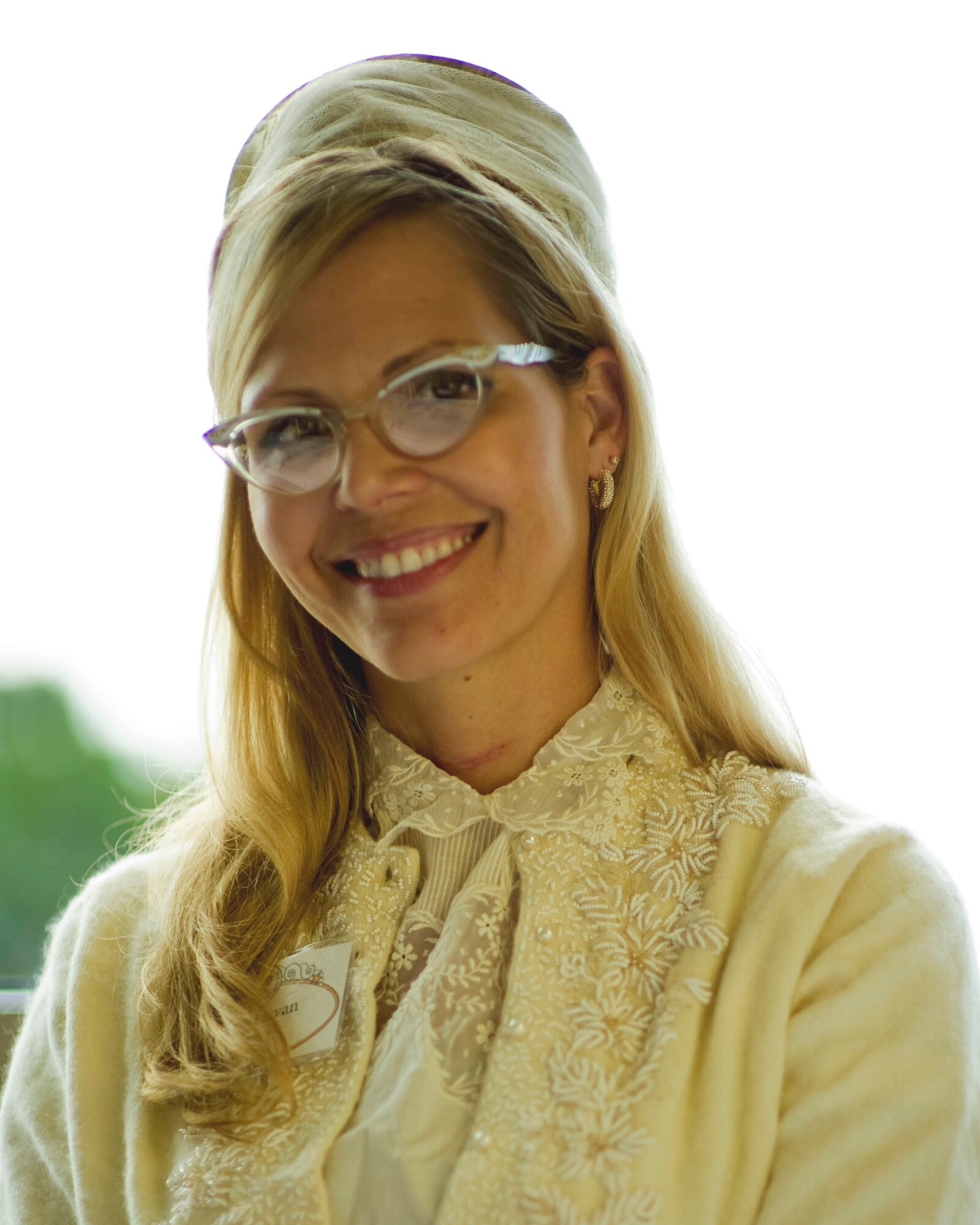 Amber Ryan, membership director of Hurlburt Spouse's Club, wears vintage clothing at the HSC 50th anniversary celebration luncheon held at the Soundside Club, Hurlburt Field Fla., Nov. 15, 2012. The luncheon featured a military etiquette presentation by the 1st Special Operations Wing protocol office, 50 years of photo scrapbooks and a then-and-now fashion show featuring nostalgic and modern thrift store clothing. (U.S. Air Force photo by Tech. Sgt. Vanessa Valentine)