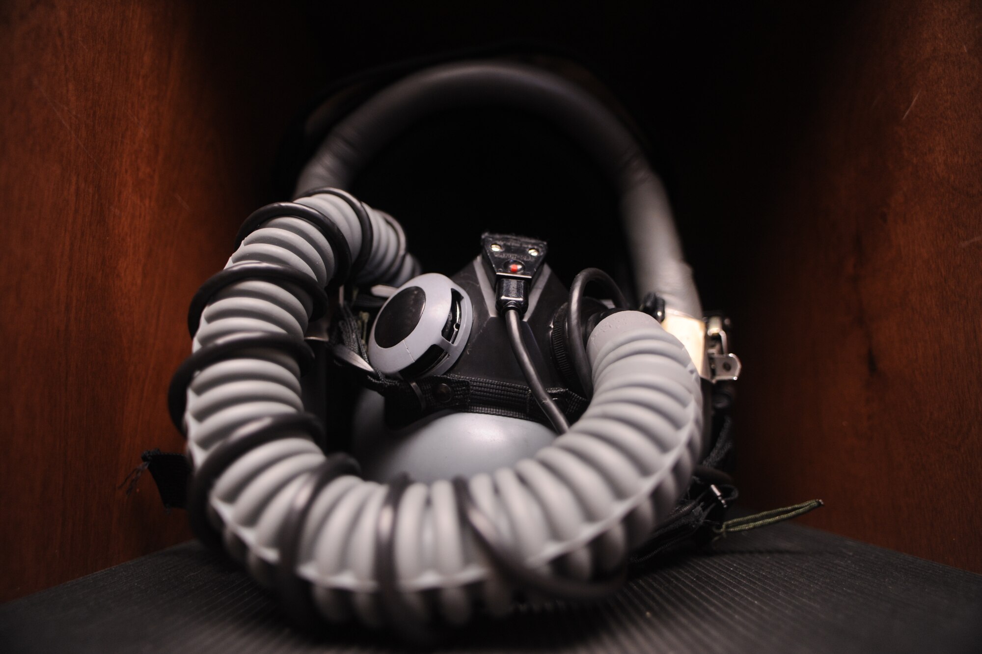A U.S. Air Force pilot’s helmet of the 357th Fighter Squadron lays displayed in a cubby at Davis-Monthan Air Force Base, Ariz., Nov. 16, 2012. The Airmen from the 355th Operations Support Squadron Aircrew Flight Equipment clean the pilot’s equipment on a monthly basis. (U.S. Air Force photo by Airman 1st Class Christine Griffiths/Released)