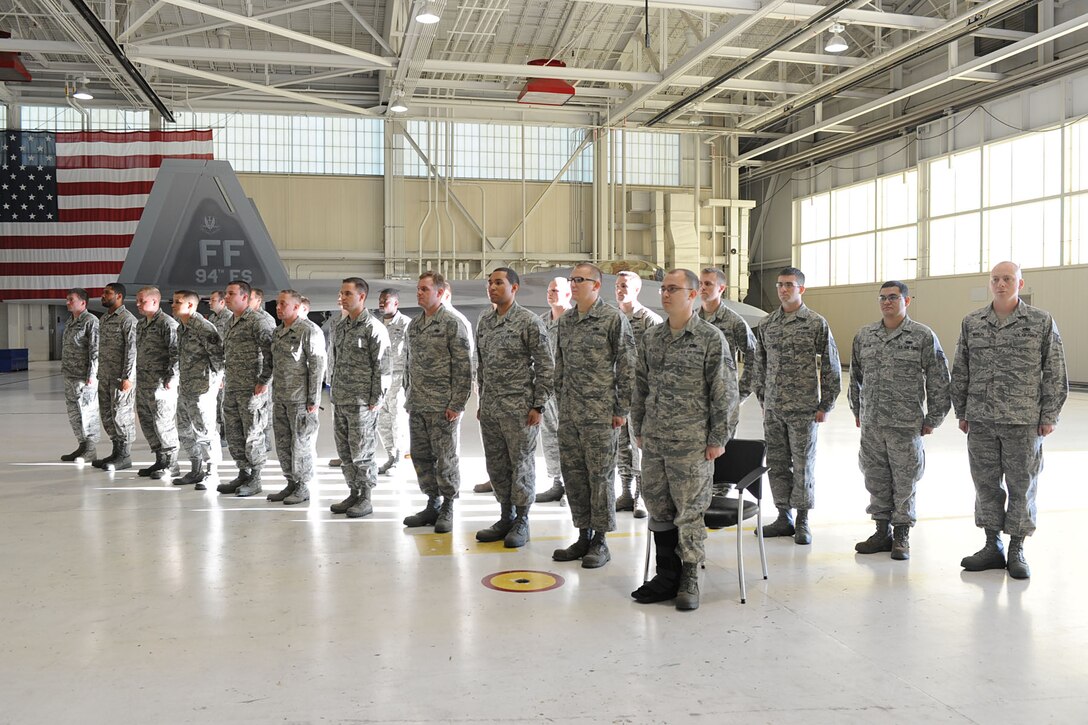 Service members with the 94th and 27th Aircraft Maintenance Squadron were recognized as dedicated crew chiefs at Langley Air Force Base, Va., Nov. 16, 2012. It is both maintenance squadrons’ tradition to officially appoint a crew chief ceremonially before they are officially recognized as a DCC. (U.S. Air Force photo by Staff Sgt. Ashley Hawkins/Released)