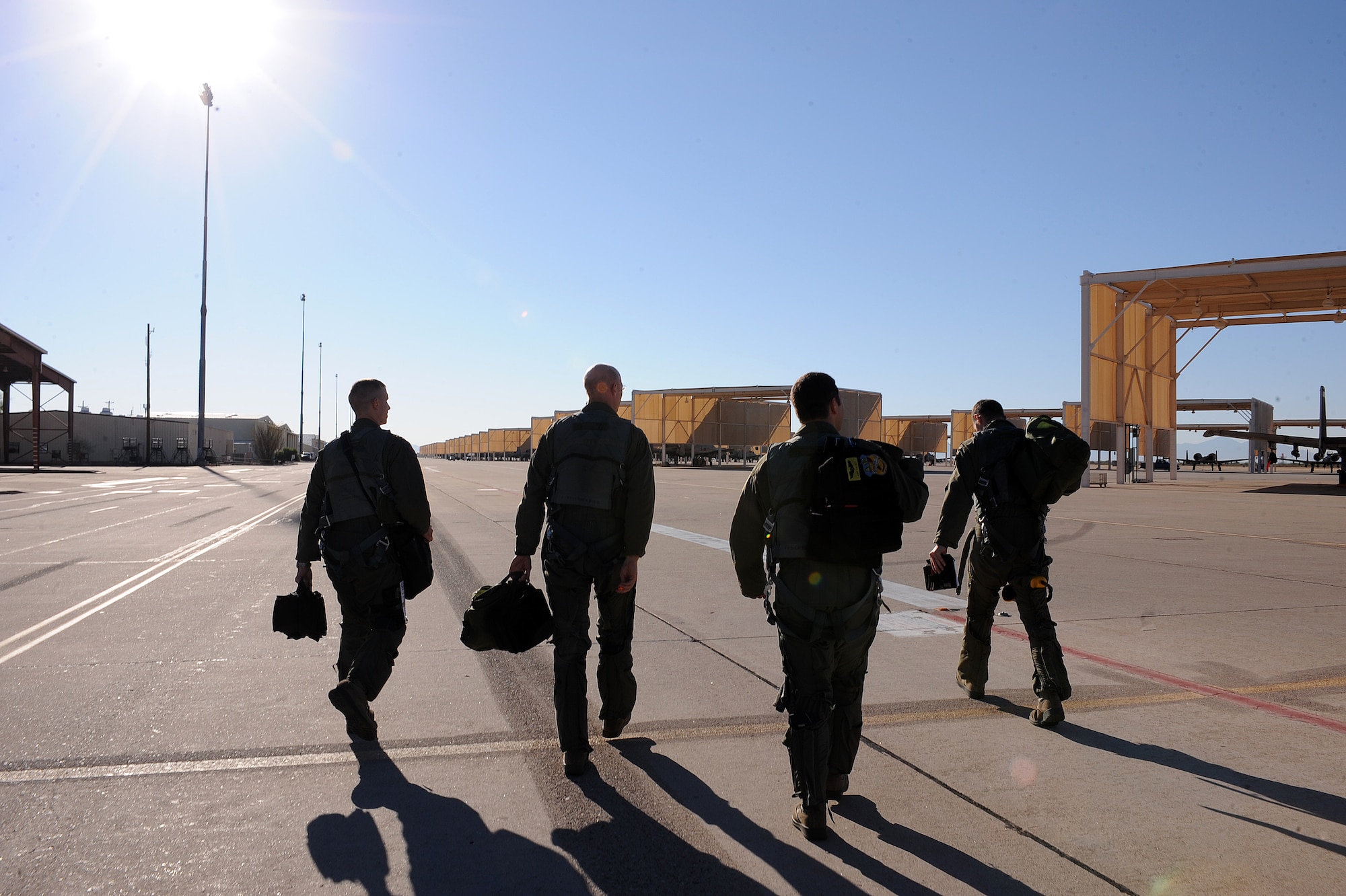 U.S. Air Force Airmen from the 357th Fighter Squadron walk to their aircraft on Davis-Monthan Air Force Base, Ariz., Nov. 7, 2012. The 357th FS student pilot training takes six months to complete. (U.S. Air Force photo by Airman 1st Class Christine Griffiths/Released)