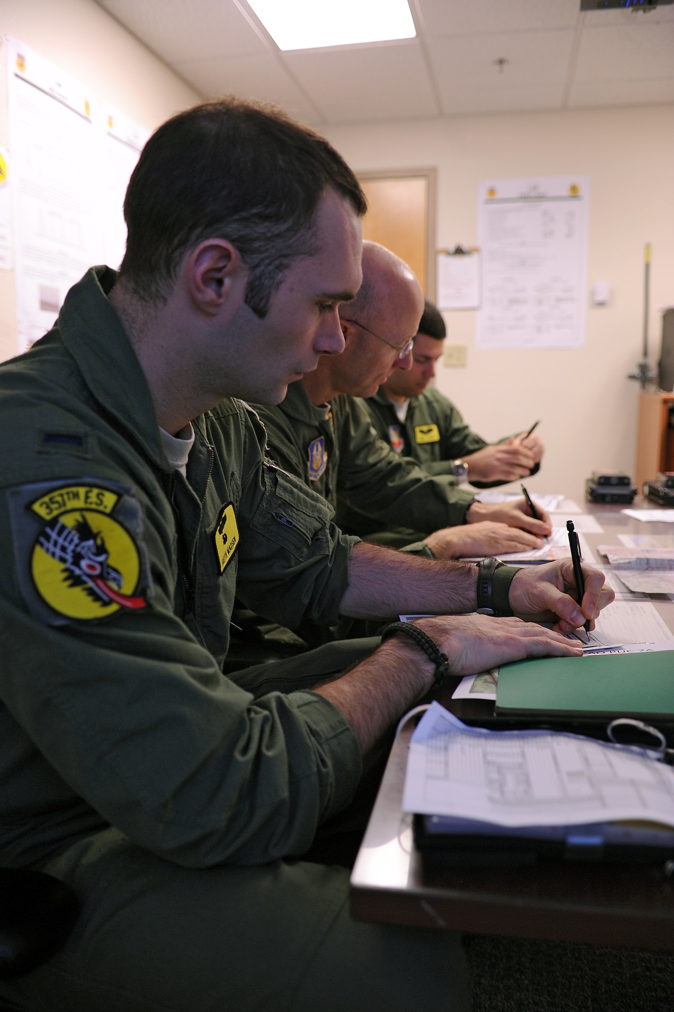U.S Air Force A-10C student pilots from the 357th Fighter Squadron make corrections to their flight scenario during their flight briefing on Davis-Monthan Air Force Base, Ariz., Nov. 7, 2012. The 357th and 358th FS are currently the only A-10 aircraft pilot training squadrons in the Air Force. (U.S. Air Force photo by Airman 1st Class Christine Griffiths/Released) 