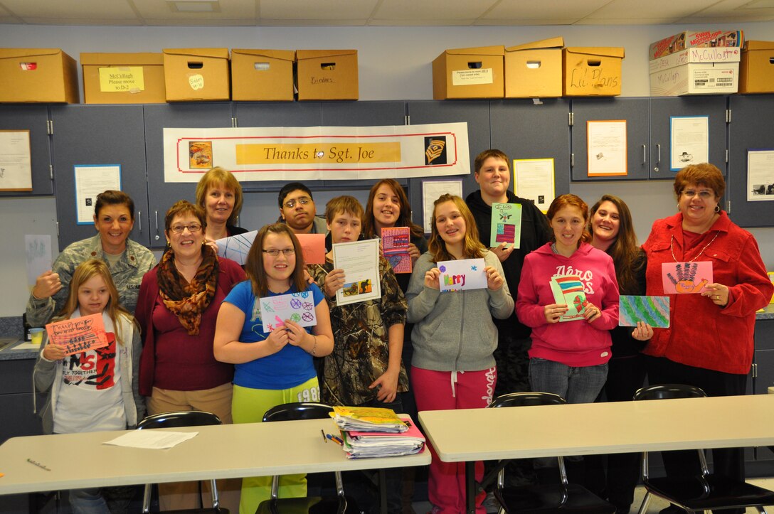 Students and teachers in Ms. Mary Graber's Niagara Wheatfield Senior High School classroom hold up letters addressed to Tech. Sgt. Joe, a deployed Airman from the 914th Airlift Wing.  The students wrote letters of appreciation and encouragment to this local serviceman who will be away from home this Thanksgiving.  (U.S. Air Force photo by Master Sgt. Kevin Nichols)
