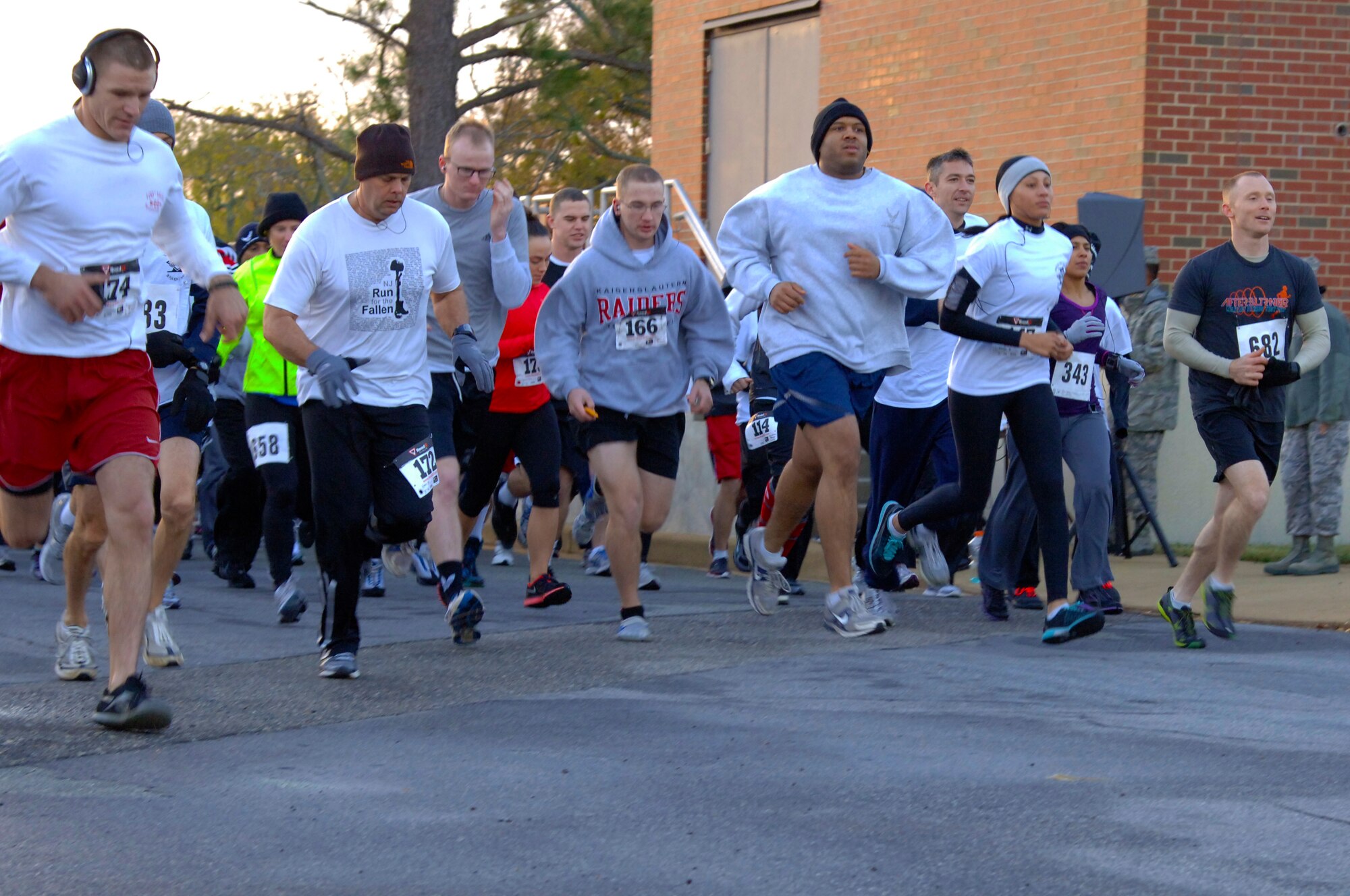 Volunteers begin running in the First Sergeants 5k fun run at Langley Air Force Base, Va., Nov. 16, 2012. The proceeds raised go to support Operation Warmheart. (U.S. Air Force photo by Airman 1st Class Victoria Taylor/Released)