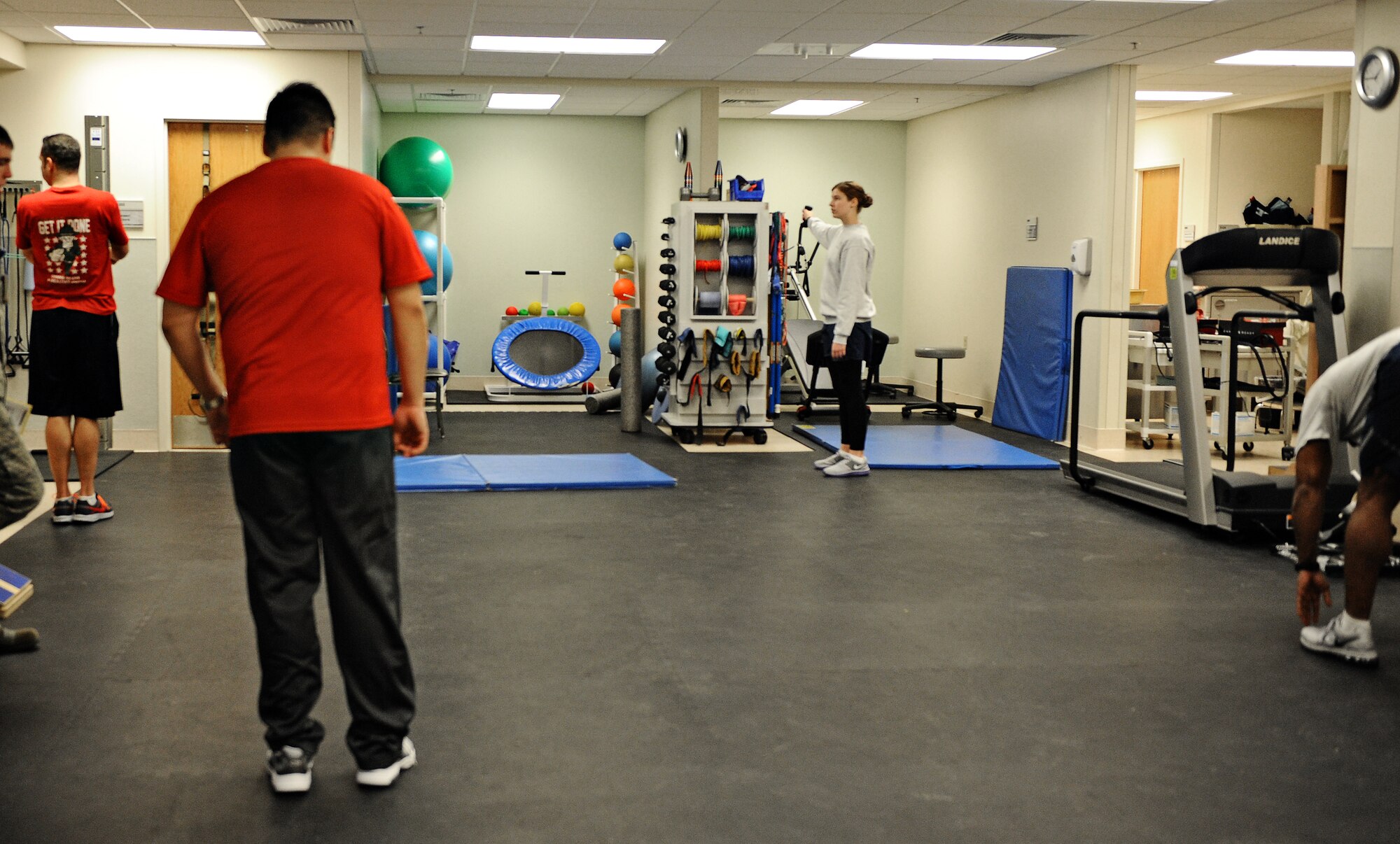 Patients at the physical therapy clinic work with specialists to rehabilitate injuries Nov. 13 at Scott Air Force Base, Ill. The physical therapy clinic houses a wide variety of equipment for patients to use in order to rehabilitate their injuries. (U.S. Air Force photo/Airman Kris Lynch)