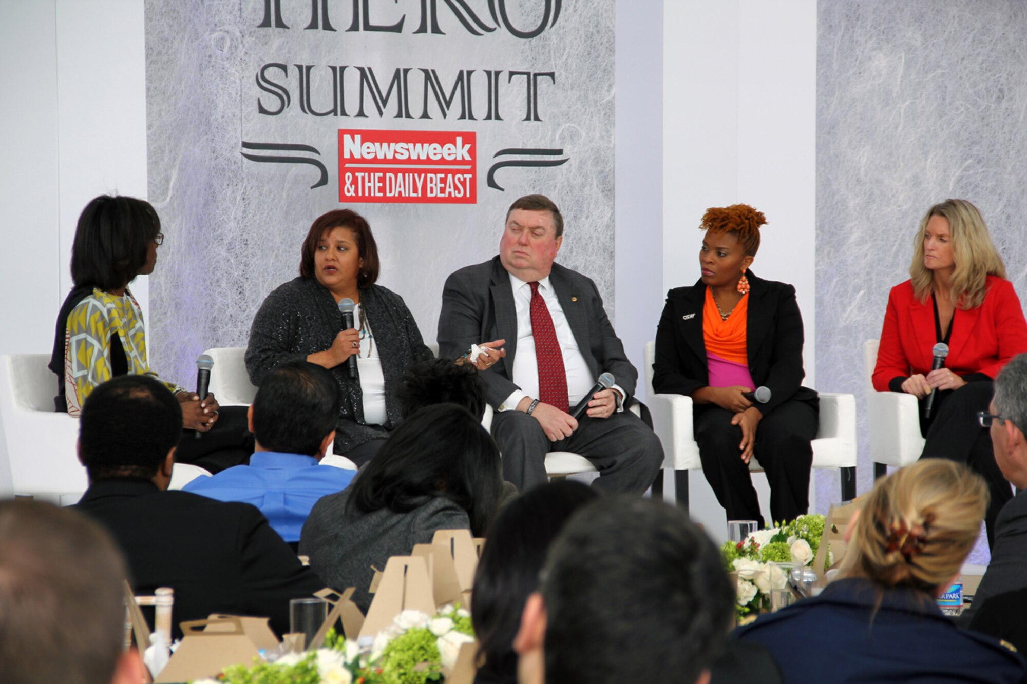 Patti Walker, left, wife of retired Army 1st Sgt. Kevin Walker and Wounded Warrior Program advocate on Fort Riley, Kan., talks to ABC News correspondent Deborah Roberts during a Hero Summit panel titled, “The Other Side of Sacrifice: Military Families” in Washington, D.C., Nov. 15, 2012. Other panel members included, from left to right, Bill Norwood, father of Marine Corps Sgt. Byron Norwood, who was killed in action; retired Air Force Maj. Lori Bell, wife of an active-duty Airman and founder and president of the National Association of Military Moms and Spouses; Kim Ruocco, widow of Marine Corps Maj. John Ruocco and Tragedy Assistance Program for Survivors national director of postvention programs. (Defense Department photo/Bradley Cantor  
