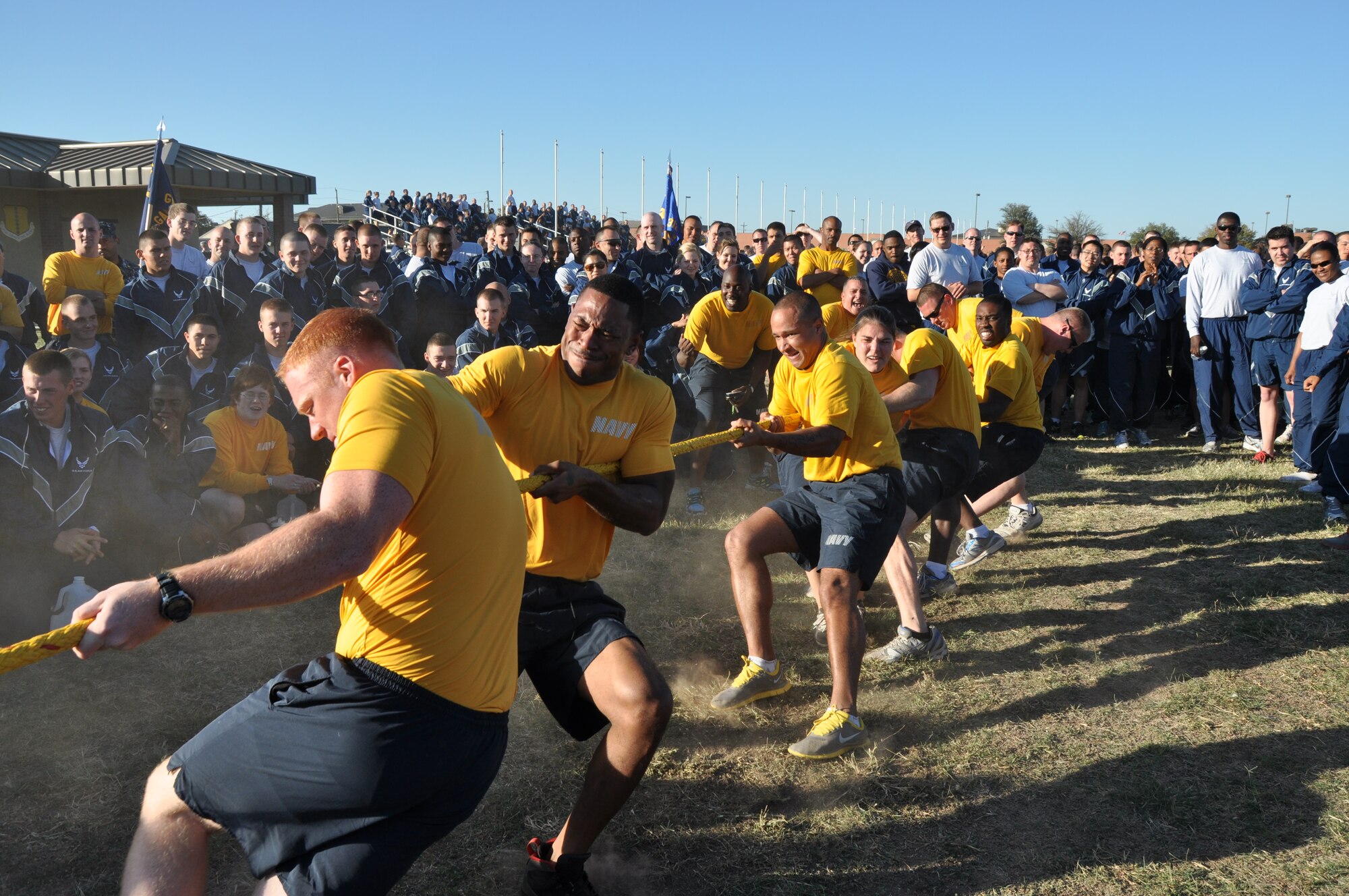 GOODFELLOW AIR FORCE BASE, Texas – Navy Center for Information Dominance Detachment members face off against 17th Training Support Squadron members in a tug-of-war match for Wingman Day at the multi-purpose field here Nov. 14. The 17th Training Support Squadron won the match and title of overall winner for small units. (U.S. Air Force photo/ Airman 1st Class Joshua Edwards)