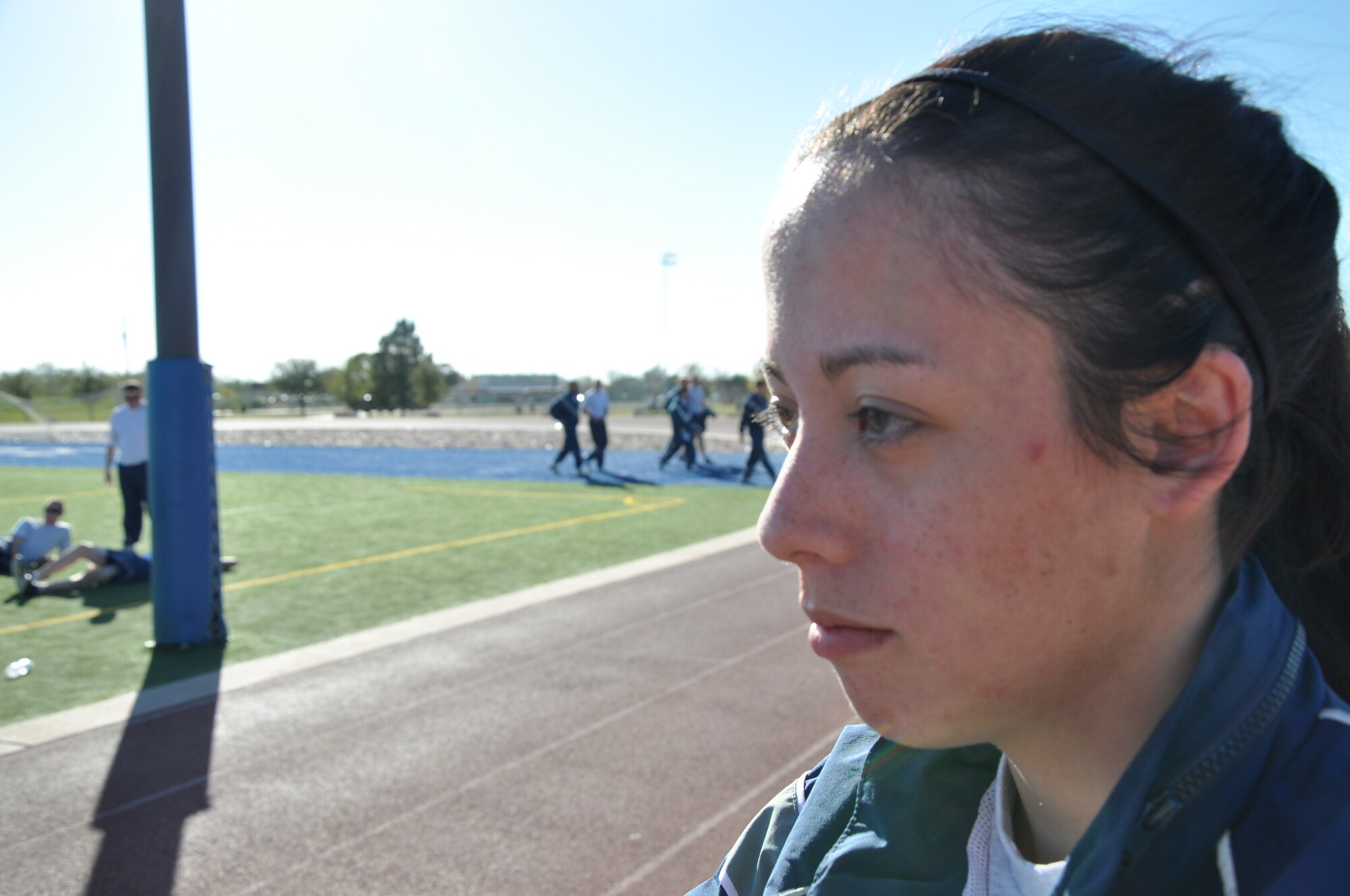 GOODFELLOW AIR FORCE BASE, Texas – Airman 1st Class Nicole Smith, 17th Medical Group dental technician, watches flag football at the Mathis Fitness Center field here Nov. 14. The game was played as part of Wingman Day which also included volleyball, dodge ball, tennis, soccer and more. (U.S. Air Force photo/ Airman 1st Class Joshua Edwards)