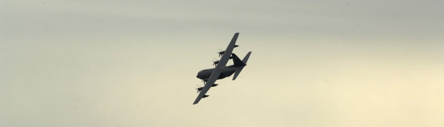 The HC-130J Combat King II flies over the flightline before landing for its ceremony on Davis-Monthan Air Force Base, Ariz., Nov. 15. The J model has new features including chaff and flare dispensers, threat detection capabilities and the ability to refuel inflight. (U.S. Air Force photo by Senior Airman Michael Washburn/Released) (U.S. Air Force photo by Senior Airman Michael Washburn/Released)