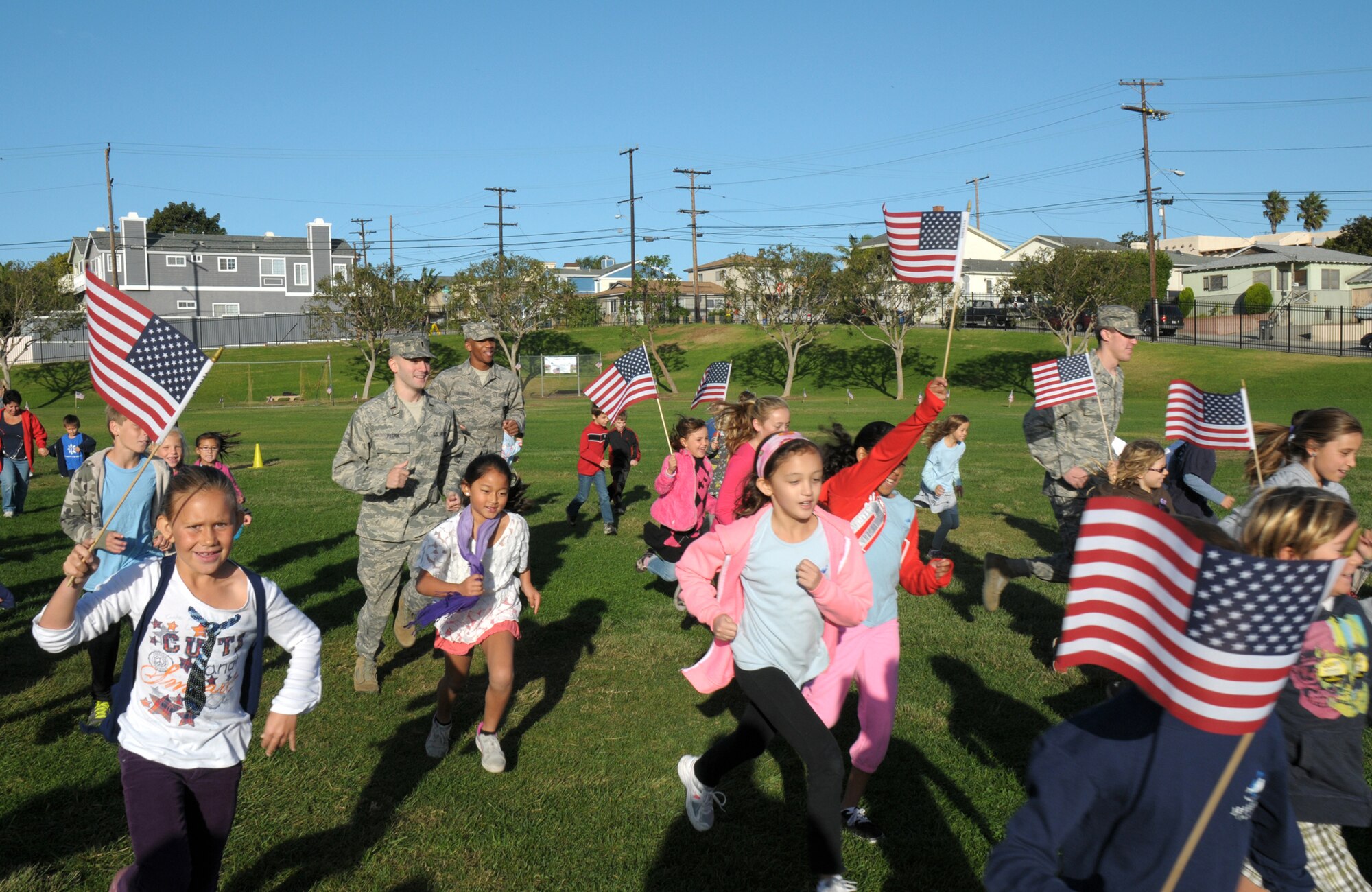 Approximately a half dozen Airmen join more than 200 students from Jefferson Elementary in Redondo Beach on their daily Running Club run, Nov. 9. Sponsored by the school’s PTA and funded by the Beach Cities Health District, the club promotes daily exercise.  (Photo by Joe Juarez)
