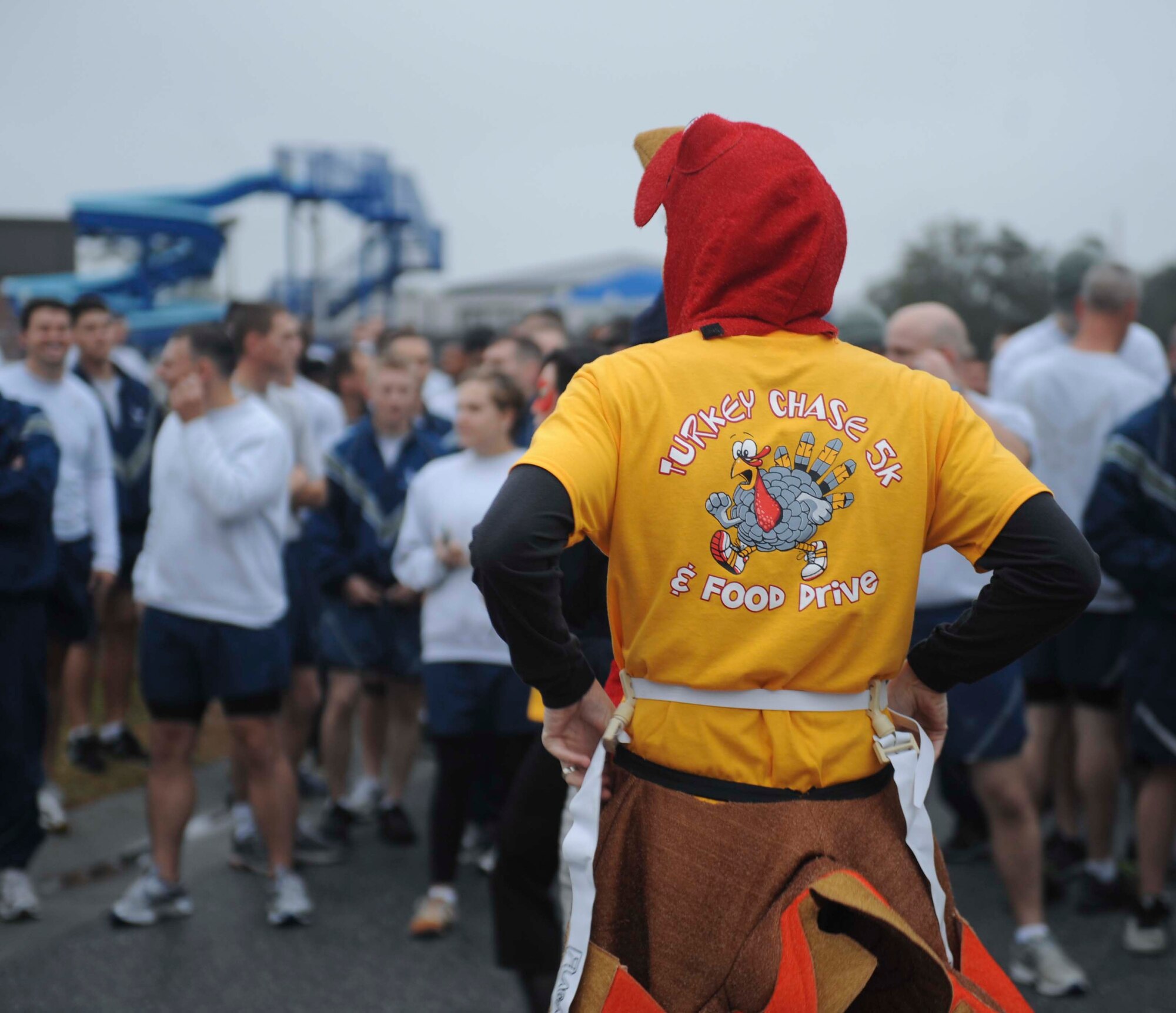 U.S. Air Force Maj. Jonathan Czarney, 23d Contracting Squadron commander, wears a turkey costume for the Turkey Chase 5K at Moody Air Force Base, Ga., Nov. 16, 2012. Seven participants dressed up as turkeys while runners chased and tried to catch them to win a T-shirt. (U.S. Air Force photo by Airman 1st Class Olivia Bumpers/Released)