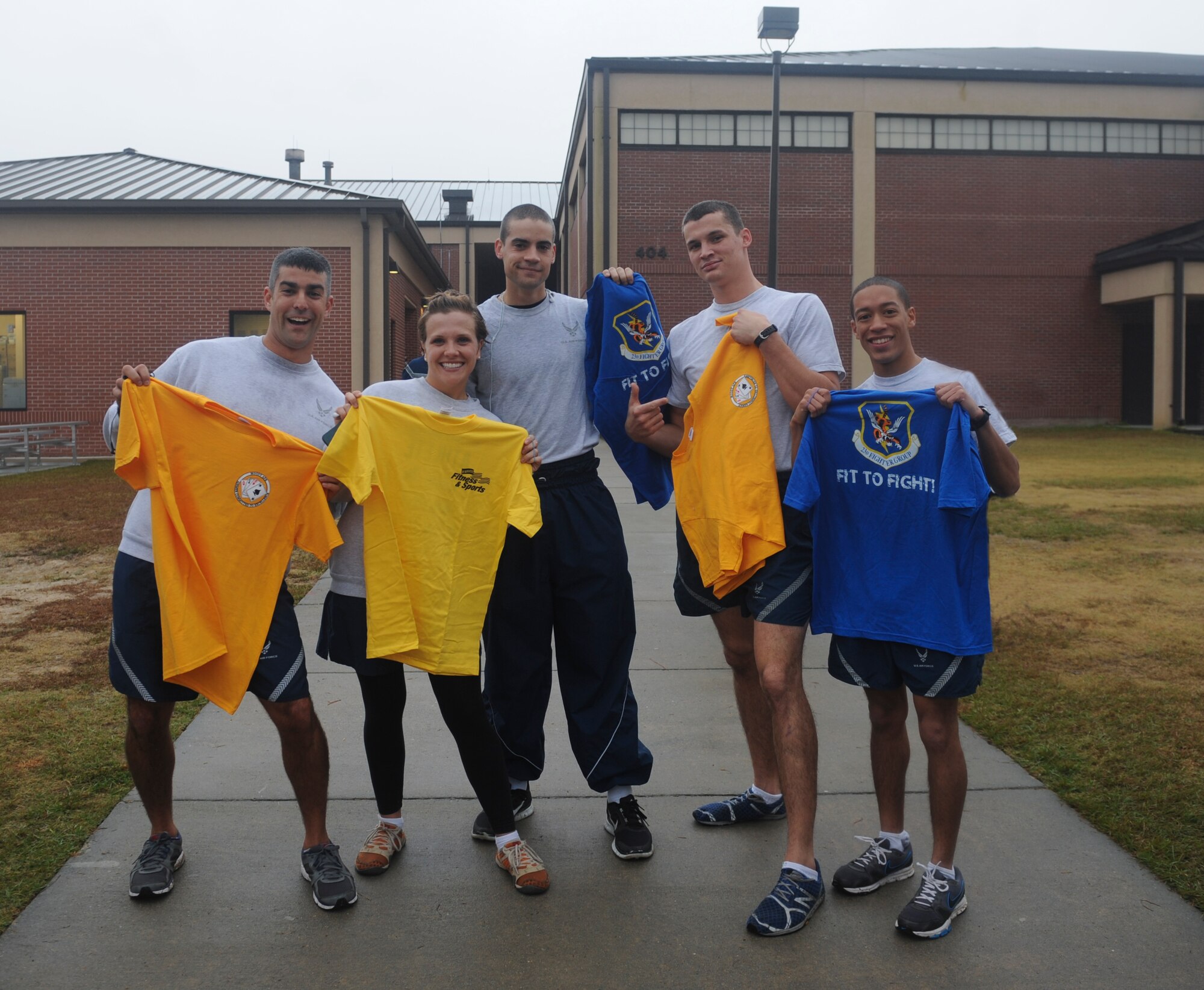 Members of the 822nd Base Defense Squadron show off T-shirts they won after the first Turkey Chase 5K at Moody Air Force Base, Ga., Nov. 16, 2012.  The event’s top 10 runners came out of the 820th BDG. (U.S. Air Force photo by Airman 1st Class Olivia Bumpers/Released)