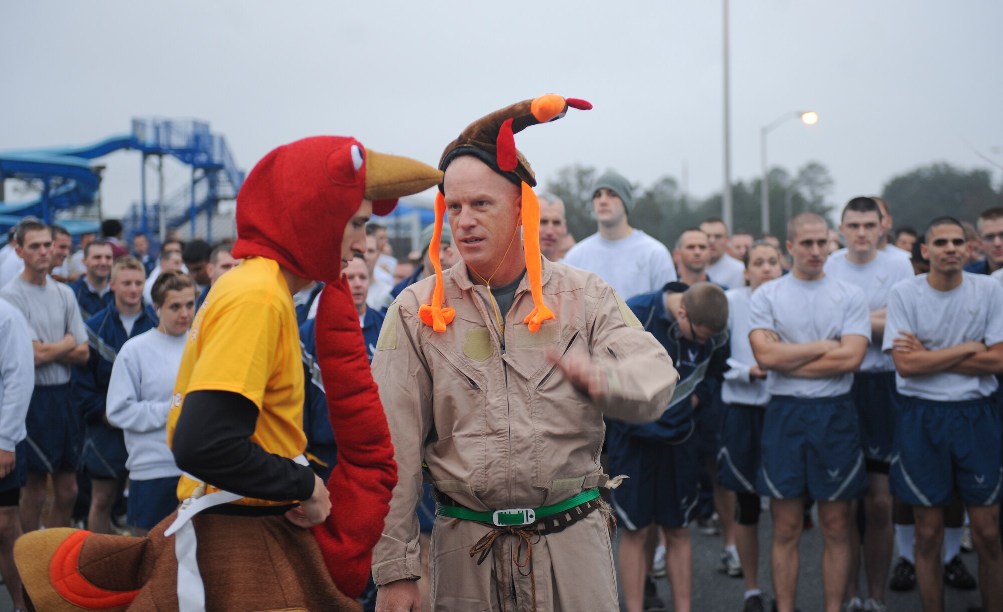 U.S. Air Force Chief Master Sgt. Frank Batten, 23d Wing command chief, and Maj. Jonathan Czarney, 23d Contracting Squadron commander, plan their location before starting the first Turkey Chase 5K at Moody Air Force Base, Ga., Nov. 16, 2012. The Airmen Committed to Excellence committee hosted the 5K and also put together a food drive collecting donations for a local soup kitchen. (U.S. Air Force photo by Airman 1st Class Olivia Bumpers/Released)