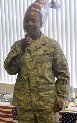 Staff Sgt. Dejon Fruga, 50th Aerial Port Squadron, temporarily assigned to 452d AMW  Blue Eagle Total Force Honor Guard, sang the National Anthem at the Moreno Valley Delivery and Distribution Center for the United States Postal Service, during a special ceremony in recognition of Veterans Day, Nov. 8. “The entire event was well received. I was honored when they all rose and removed their hats to pay respect during my performance,” said Fruga. “They repeatedly thanked me for attending the ceremony and most importantly, for my service to country. Next year, if they need me, I will be there!” (U.S. Air Force photo by Darnell Gardner) 