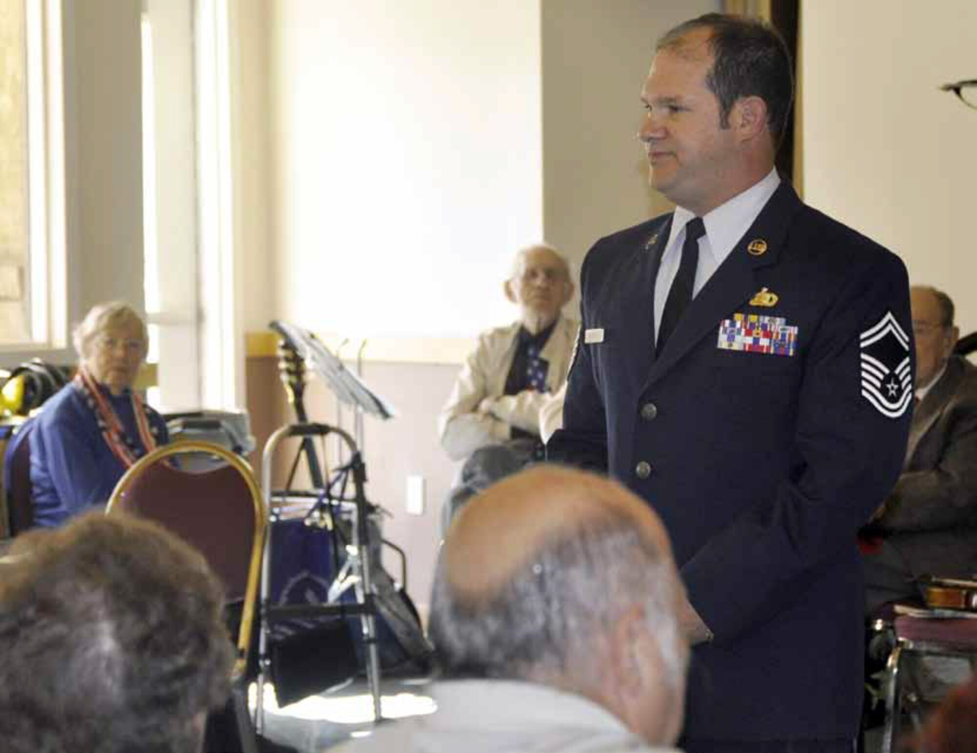 Senior Master Sgt. William Griffey, 452d AMW Maintenance Training Flight, delivered a “Hero” speech at the Janet Goeske Senior Center for their annual Veterans Day program to honor all military branches for serving in the Armed Forces, Nov.9. “I think a day like Veterans Day has an effect on more than just veterans, it has an effect
on the United States as a whole,” said Griffey. “It is a day that veterans are celebrated and thanked for their unyielding dedication for what they do and it is nice to know, as a veteran, that people have cared and still continue to care for the Armed Forces as a whole.” (U.S. Air Force photo by Darnell Gardner)