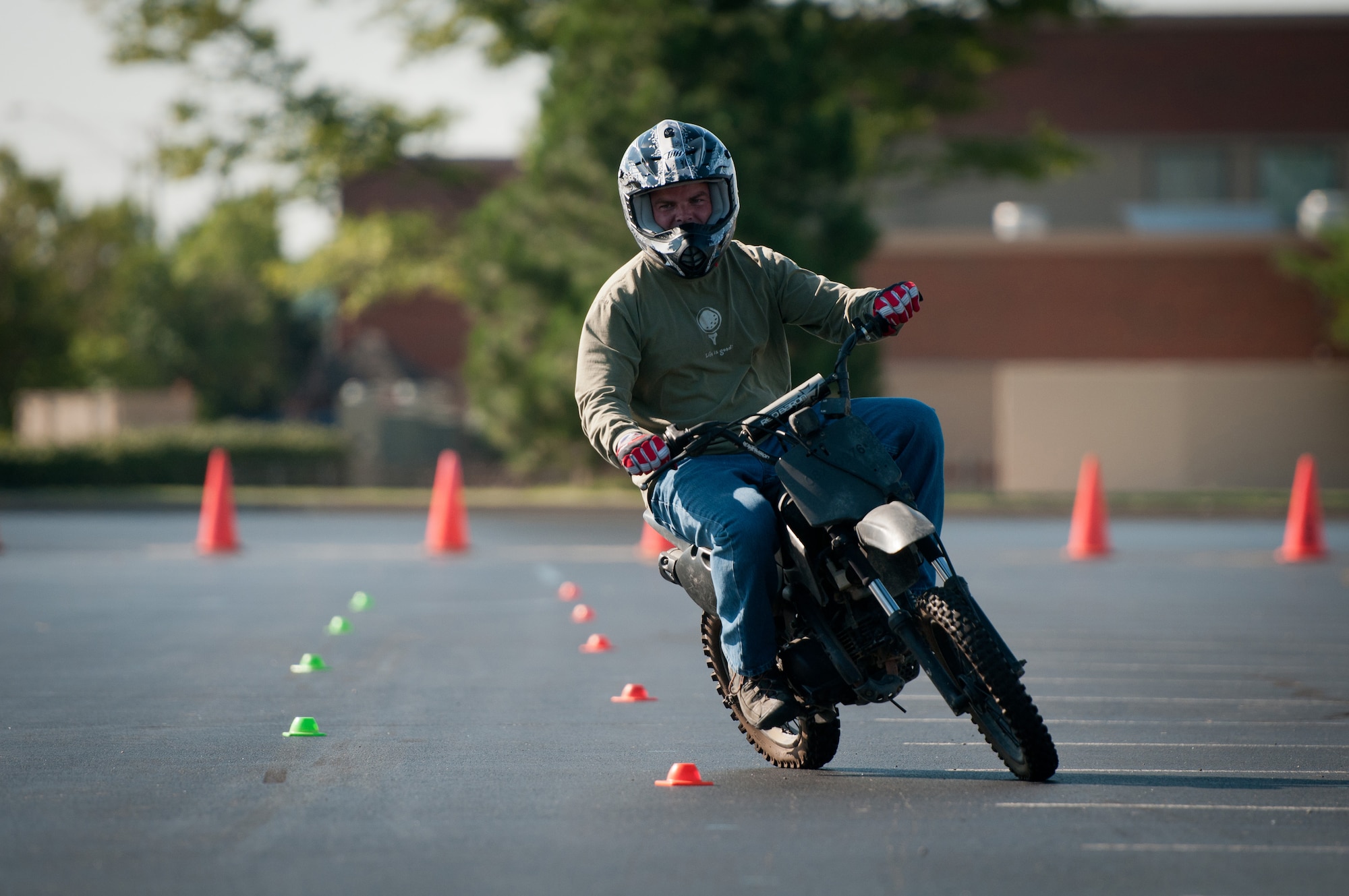 Kentucky Air National Guard Tech. Sgt. Don Yeats, 123rd Special Tactics Squadron radio maintenance specialist, weaves in out of cones during a motorcycle safety train-the-trainer course at the Kentucky Air National Guard Base in Louisville, Ky., on Aug. 23, 2012. The course, part of the Motorcycle Safety Foundation's RiderCoach Program, was designed in part to train student instructors so they can go on to teach motorcycle safety to other service members. (Kentucky Air National Guard photo by Master Sgt. Phil Speck)
