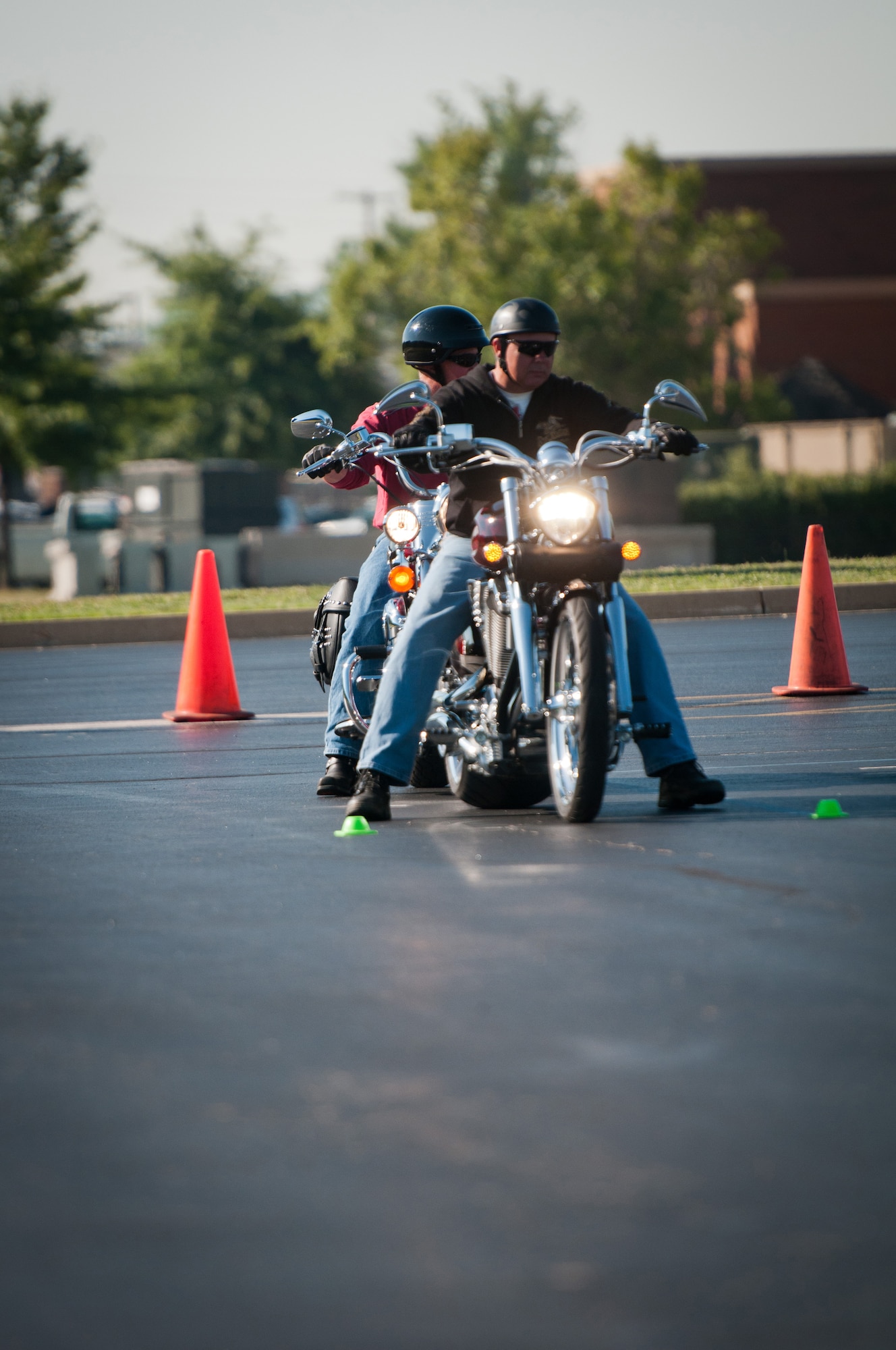 Kentucky Air National Guard Maj. Todd Franks, a C-130 Hercules pilot with the 165th Airlift Squadron, discusses basic motorcycle maneuvers with a fellow student during a motorcycle safety train-the-trainer course at the Kentucky Air National Guard Base in Louisville, Ky., on Aug. 22, 2012. The course, part of the Motorcycle Safety Foundation's RiderCoach Program, was designed in part to train student instructors so they can go on to teach motorcycle safety to other service members. (Kentucky Air National Guard photo by Master Sgt. Phil Speck)