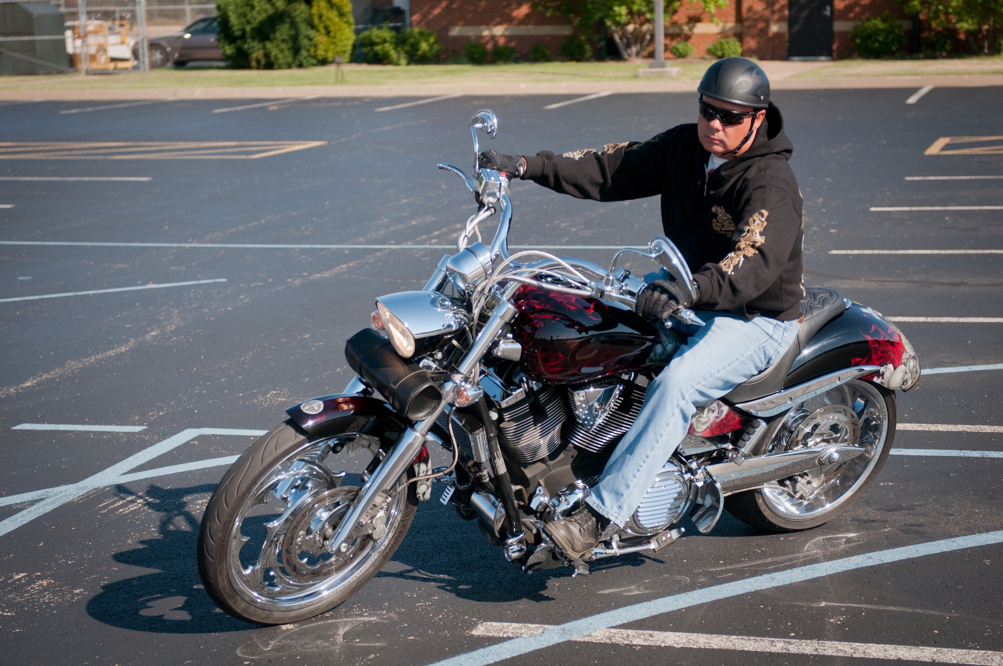 Kentucky Air National Guard Master Sgt. Mark Williams, vehicle operations non-commissioned-officer-in-charge for the 123rd Logistics Readiness Squadron, turns a corner during a motorcycle safety train-the-trainer course at the Kentucky Air National Guard Base in Louisville, Ky., on Aug. 22, 2012. The course, part of the Motorcycle Safety Foundation's RiderCoach Program, was designed in part to train student instructors so they can go on to teach motorcycle safety to other service members. (Kentucky Air National Guard photo by Master Sgt. Phil Speck)