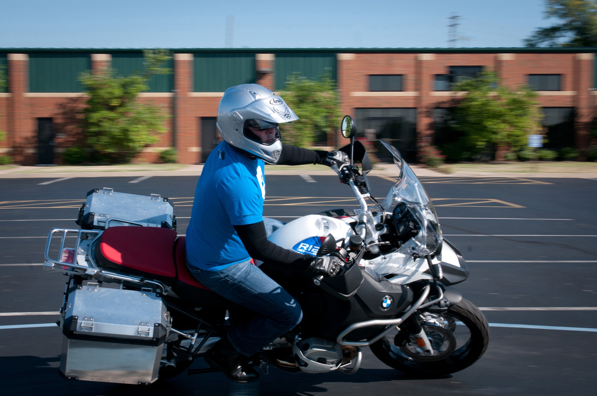 Kentucky Air National Guard Maj. Todd Franks, a C-130 Hercules pilot in the 165th Airlift Squadron, makes a sharp turn during a motorcycle safety train-the-trainer course at the Kentucky Air National Guard Base in Louisville, Ky., on Aug. 22, 2012. The course, part of the Motorcycle Safety Foundation's RiderCoach Program, was designed in part to train student instructors so they can go on to teach motorcycle safety to other service members. (Kentucky Air National Guard photo by Master Sgt. Phil Speck)