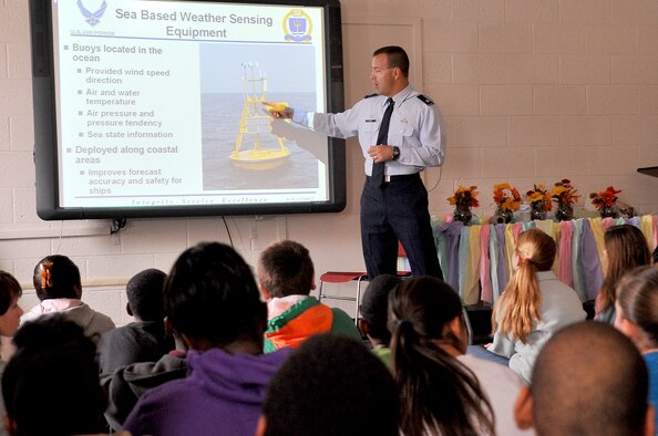 U.S. Air Force Lt. Col. Jeffrey Jarry, 28th Operational Weather Squadron commander, explains to the children about his job and how some of the weather equipment works, Pinewood, S.C., Nov. 13, 2012. Jarry also gave the kids insight on the history of Veterans Day and the life of a military service member. (U.S. Air Force photo by Airman 1st Class Ashley L. Gardner/ Released)

