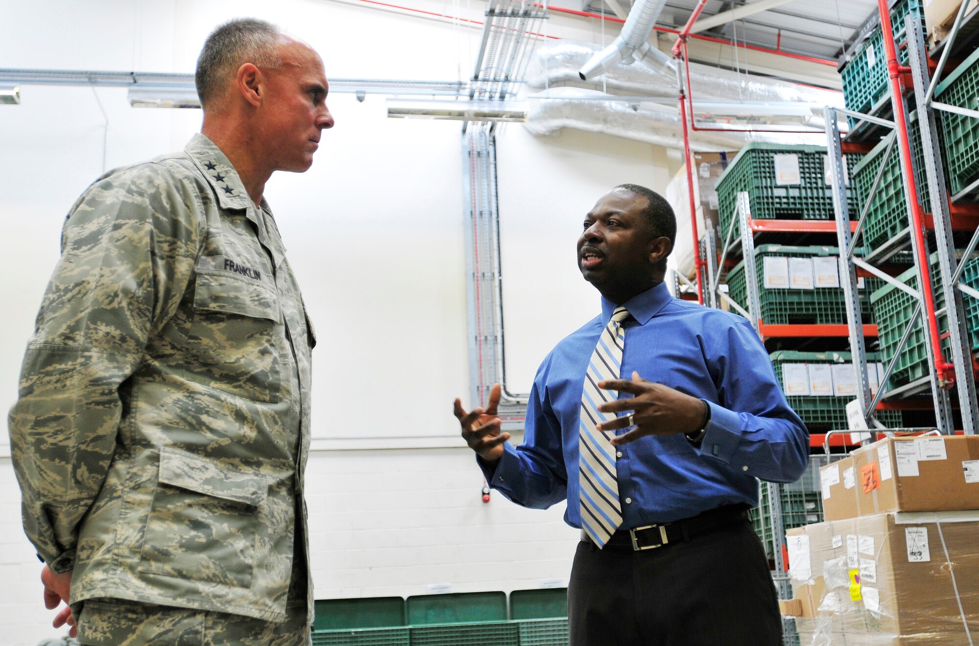 ROYAL AIR FORCE LAKENHEATH, England – Mr. Curtis Briggs, 48th Logistics Readiness Squadron installation deployment officer, explains the processes and procedures for the personnel deployment function and the cargo deployment function to Lt. Gen. Craig Franklin, 3rd Air Force commander, at the installation deployment readiness center, Nov. 14, 2012. Franklin visited RAF Lakenheath as part of his immersion since becoming the 3rd AF commander in March. He visited the hospital, IDRC, Hangars 6 and 7, fire department, 56th Rescue Squadron and other areas around the base to familiarize himself with the 48th Fighter Wing members and mission. (U.S. Air Force photo by Senior Airman Tiffany M. Grigg) 