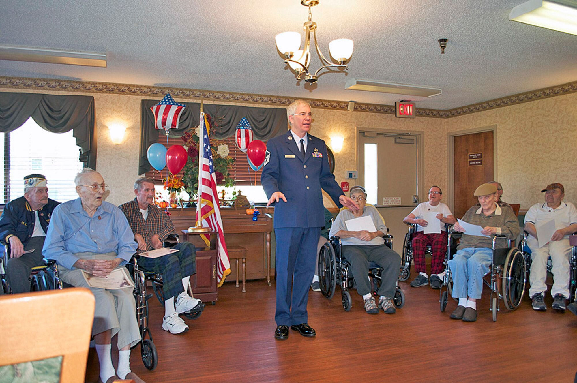 WRIGHT-PATTERSON AIR FORCE BASE, Ohio – Master Sgt. Charles Miller, 445th Airlift Wing public affairs superintendent, visits with veterans at Villa Springfield nursing home, Springfield, Ohio, during their annual Veterans Day ceremony Nov. 9. Miller spoke to the group about the 445 AW and shared his experiences as a reservist. (Courtesy photo)
