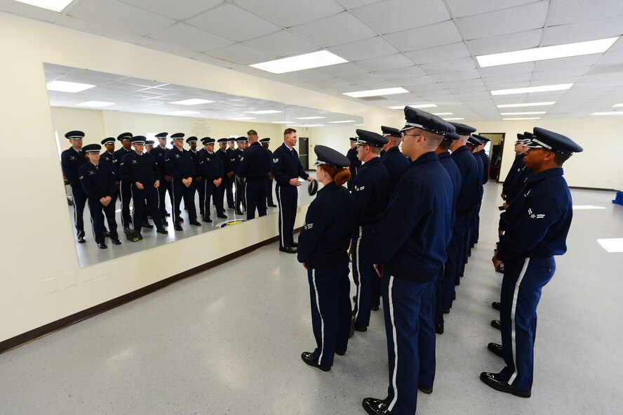 U.S. Air Force Airmen from the Shaw Air Force Base honor guard prepare for an active-duty funeral at Shaw Air Force Base, S.C., Nov. 14, 2012. Every three months, Airmen at Shaw volunteer or are selected by their squadron to be a part of the base honor guard. Their honor guard service lasts up to a year with three month rotations. (U.S. Air Force photo by Airman Nicole Sikorski/Released)