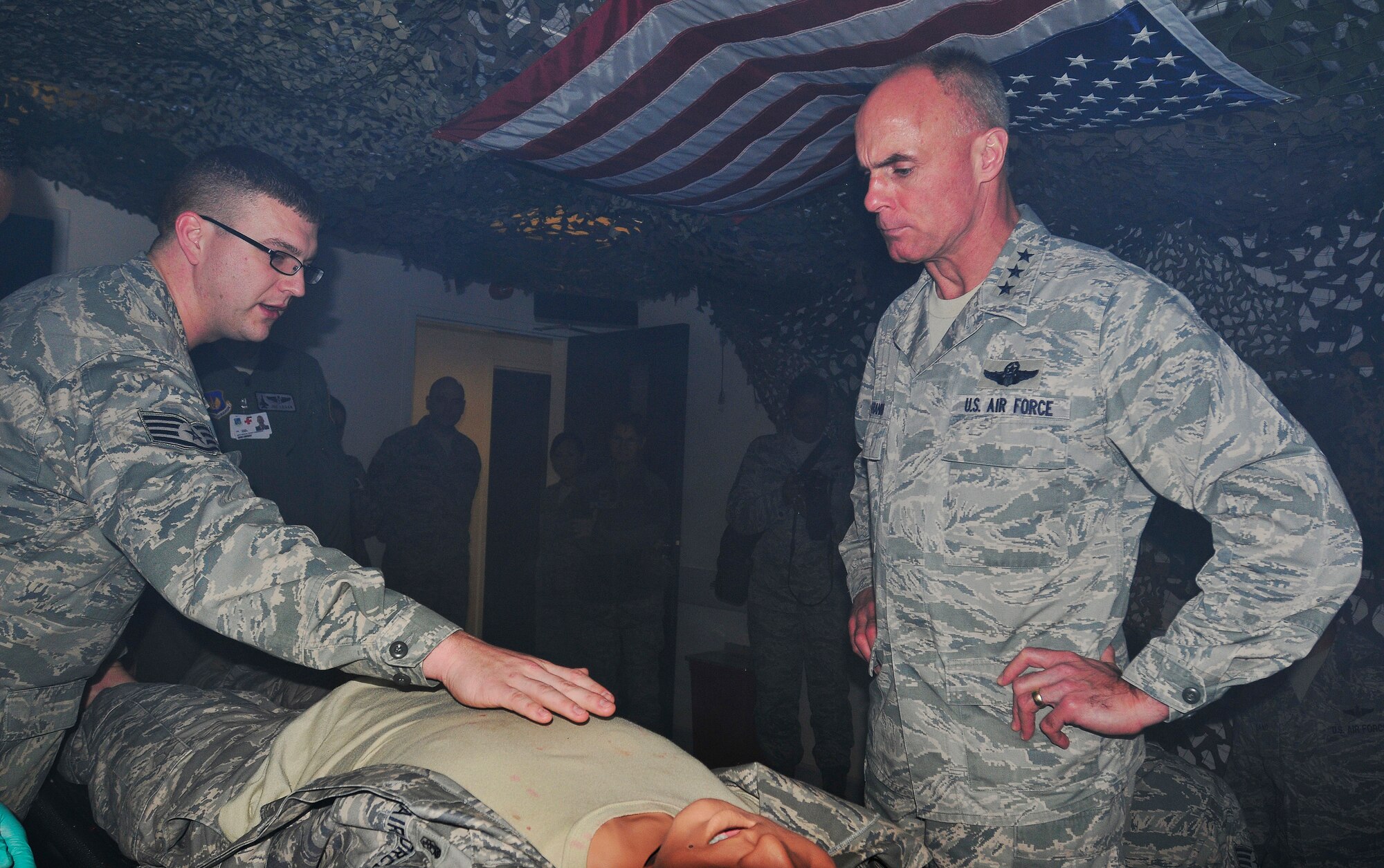 ROYAL AIR FORCE LAKENHEATH, England - Staff Sgt. Matthew Kosemund, 48th Medical Operations Squadron NCO in charge of medical simulation, explains the functions of the United States Air Forces in Europe Tier 1 Medical Simulation Center to Lt. Gen. Craig Franklin, 3rd Air Force commander, in the medical training complex, Nov. 14, 2012. Franklin visited RAF Lakenheath as part of his immersion since becoming the 3rd AF commander in March. He visited the hospital, IDRC, Hangars 6 and 7, fire department, 56th Rescue Squadron and other areas around the base to familiarize himself with the 48th Fighter Wing members and mission. (U.S. Air Force photo by Senior Airman Tiffany M. Grigg) 