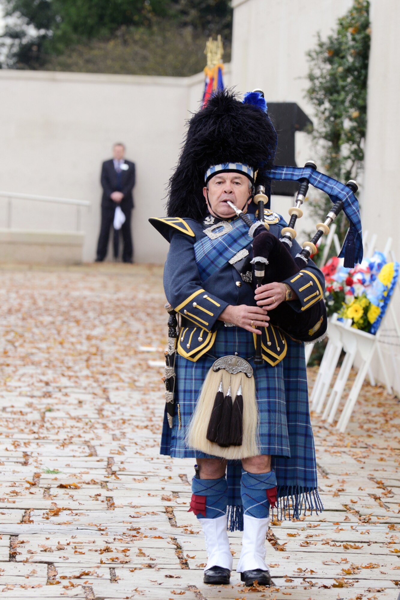 CAMBRIDGE, United Kingdom – Retired Royal Air Force Piper Warrant Officer Gary Kernaghan plays the lament “Flowers of the Forest,” during the Veteran’s Day ceremony at Cambridge American Cemetery Nov. 12. Laid to rest at Cambridge American Cemetery are 3,812 killed in World War II and the names of 5,126 of the missing are engraved in the Tablets of the Missing. (U.S. Air Force photo by Staff Sgt. Brian Stives)