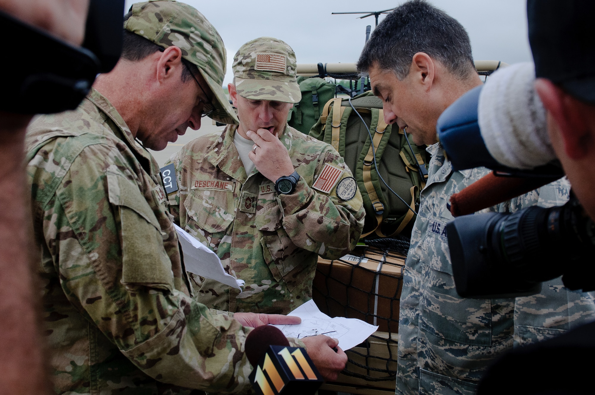 Members of the Kentucky Air National Guard's 123rd Special Tactics Squadron brief Col. Warren Hurst about operational capabilities at Campbell Army Airfield during an earthquake-response exercise May 14, 2012, at Fort Campbell, Ky. About 20 Kentucky Airmen, all assigned to Kentucky's Initial Response Hub package, determined the kinds of airlift operations the facility could support and opened the ramp for incoming relief and aeromedical evacuation flights within five hours of being called to duty. (U.S. Air Force photo by Senior Airman Maxwell Rechel)