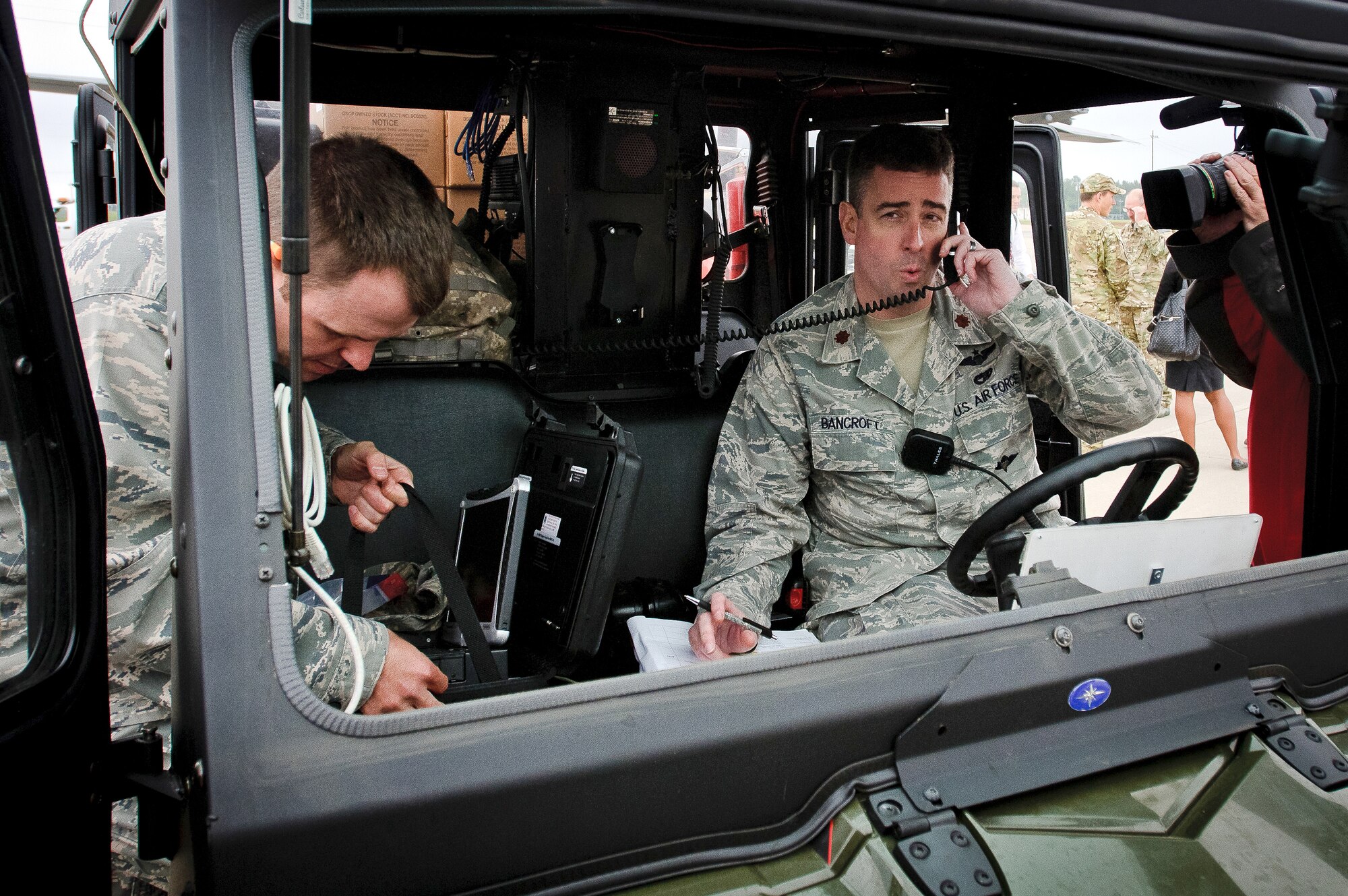 Maj. Bruce Bancroft, operations officer for the Kentucky Air National Guard's 123rd Contingency Response Group, relays ground conditions back to higher headquarters during an earthquake-response exercise May 14, 2012, at Fort Campbell, Ky. Bancroft was one of about 20 Kentucky Airmen examined all aspects of Campbell Army Airfield for simulated earthquake damage, determined the kinds of airlift operations the facility could support and opened the ramp for incoming relief and aeromedical evacuation flights within five hours of being called to duty. (U.S. Air Force photo by Senior Airman Maxwell Rechel)