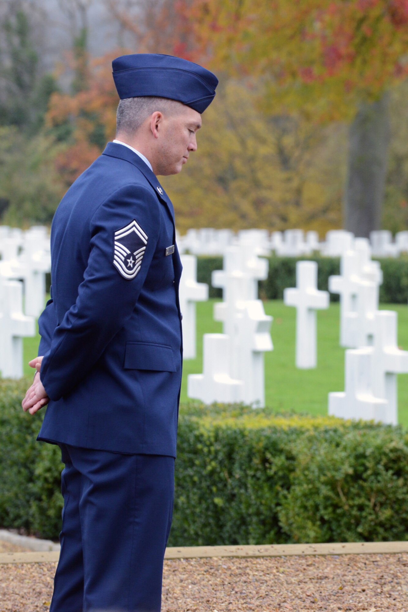 CAMBRIDGE, United Kingdom – Senior Master Sgt. Gene Eastman, 501st CSW Regional Contracting Office chief, reflects on the events happening during the Veteran’s Day ceremony at Cambridge American Cemetery Nov. 12. Laid to rest at Cambridge American Cemetery are 3,812 killed in World War II and 5,126 names of the missing are engraved in the Tablets of the Missing. (U.S. Air Force photo by Staff Sgt. Brian Stives)