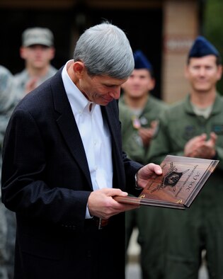 Retired U.S. Air Force Gen. Norton Schwartz, former Chief of Staff of the Air Force, reads his Order of the Sword nomination plaque while outside the distinguished visitors quarters at Hurlburt Field, Fla., Nov. 15, 2012. The Order of the Sword is the highest honor the enlisted corps can bestow upon an individual in recognition of significant contributions to the enlisted force. (U.S. Air Force photo / Airman 1st Class Christopher Williams) (RELEASED)
