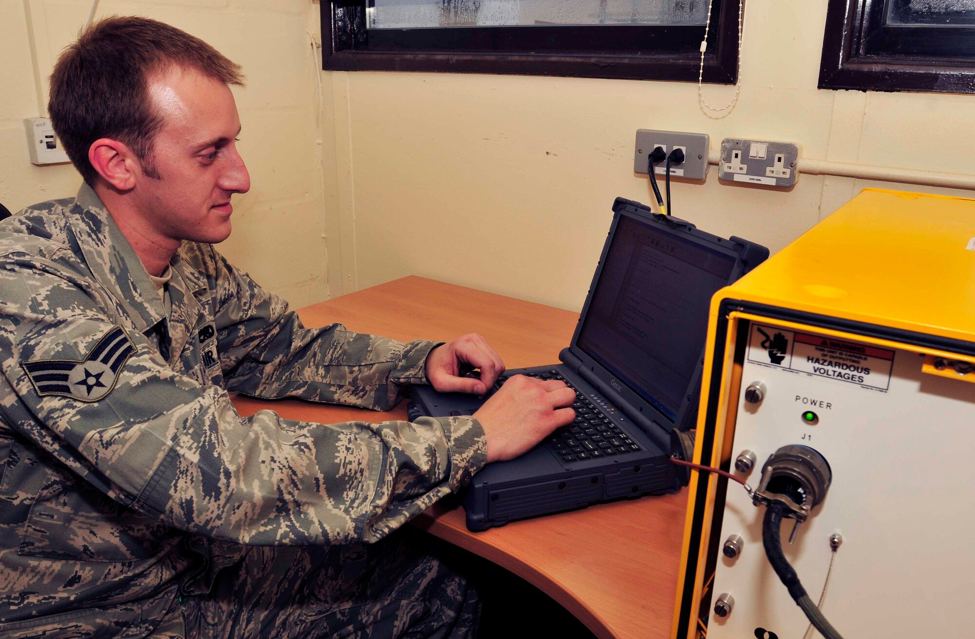ROYAL AIR FORCE LAKENHEATH, England - Senior Airman David Grove, 48th Component Maintenance Squadron electro environmental systems journeyman and Springfield, Ill. native, types a program for the automatic wire test set in the electro-environmental shop Nov. 8, 2012. Hydraulics, fuels, electro-environmental and emergency global rescue, escape and survival systems are the four sections that make up the accessories flight. They are responsible for intermediate level maintenance on the components of the F-15. (U.S. Air Force photo by Senior Airman Tiffany M. Grigg)