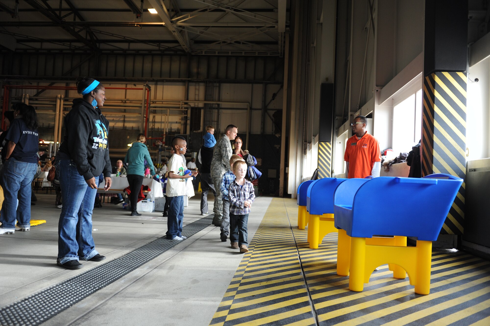 Members of Team Ramstein participate in ring toss games during Resiliency Day in Hangar 1 on Ramstein Air Base, Germany, Nov. 9, 2012. Resiliency Day is an opportunity for Airmen of all ranks to take a break from normal duties and acknowledge achievements from the past few months. (U.S. Air Force photo/Airman 1st Class Holly Cook)