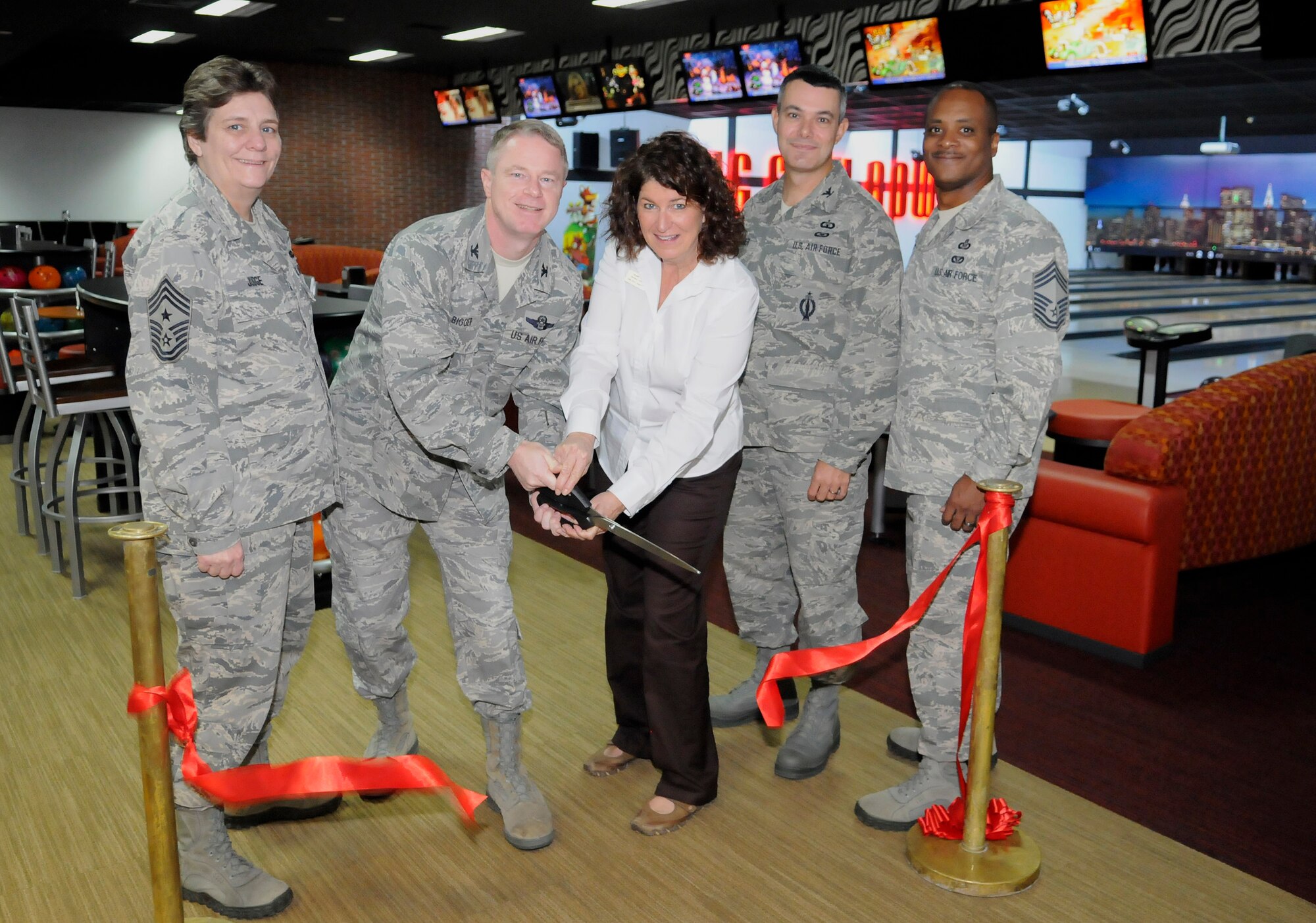 Col. Brent Bigger, 39th Air Base Wing vice commander, and Mary Wall, 39th Force Support Squadron Big City Bowl manager, along with Col. Sean Gallagher, 39th Mission Support Group commander, Chief Master Sgt. Nancy Judge, 39th ABW command chief, and Chief Master Sgt. Roderick Dycus, 39th MSG chief, cut the ribbon for the grand opening of the Big City Bowl bowling center Nov. 16, 2012, Incirlik Air Base, Turkey. Big City Bowl bowling center was under renovations for six-months. (U.S. Air Force photo by Staff Sgt. Veuril Mcdavid/Released)