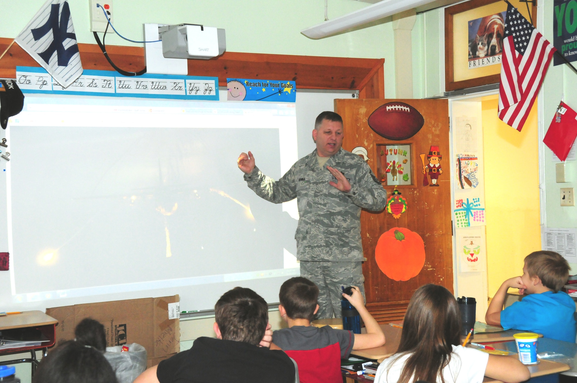 Master Sgt. Kenneth Devole, 107th Airlift Wing Vehicle Operations Supervisor, New York Air National Guard, was invited to visit a third-grade class at Colonial Village Elementary School, Town of Lewiston,  N.Y. Nov. 14, 2012. Sgt. Devole talked about his past deployments, his career goals and the importance of education.  (Air National Guard Photo/Senior Master Sgt. Ray Lloyd)