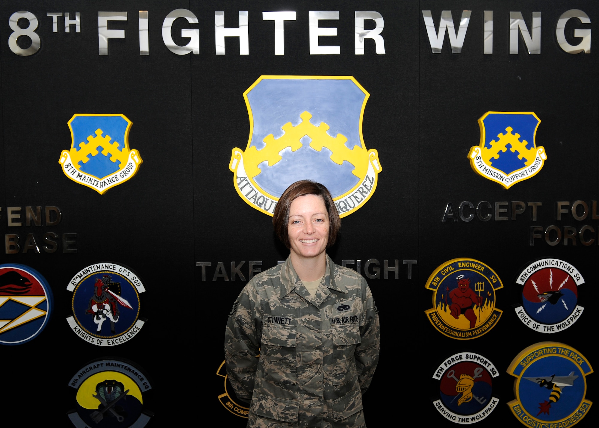 Staff Sgt. Jennifer Stinnett, 8th Fighter Wing, command chief executive assistant is awarded  Pride of the Pack on Kunsan Air Base Republic of Korea, Nov. 15, 2012. Stinnett was recognized for her excellence at her job, and off-duty volunteer work. (U.S. Air Force Photo/ Senior Airman Marcus Morris.)