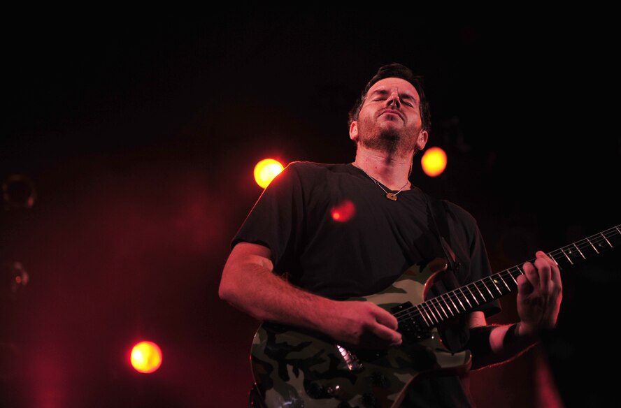 Dan Estrin, guitarist for Hoobastank, an American rock band, performs for service members and their families from across Okinawa on Kadena Air Base, Japan, Nov. 15, 2012. Thousands of service members and their families came out to the Emery Bowling Center for the free concert put on by the 18th Force Support Squadron. (U.S. Air Force photo/Staff Sgt. Sara Csurilla)