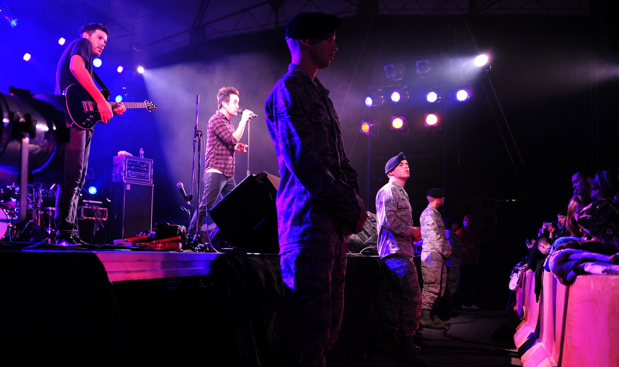 Airmen from the 18th Security Forces Squadron guard the stage as Hoobastank, an American rock band, perform for service members and their families from across Okinawa on Kadena Air Base, Japan, Nov. 15, 2012. Thousands of service members and their families came out to the Emery Bowling Center for the free concert put on by the 18th Force Support Squadron. (U.S. Air Force photo/Staff Sgt. Sara Csurilla) 