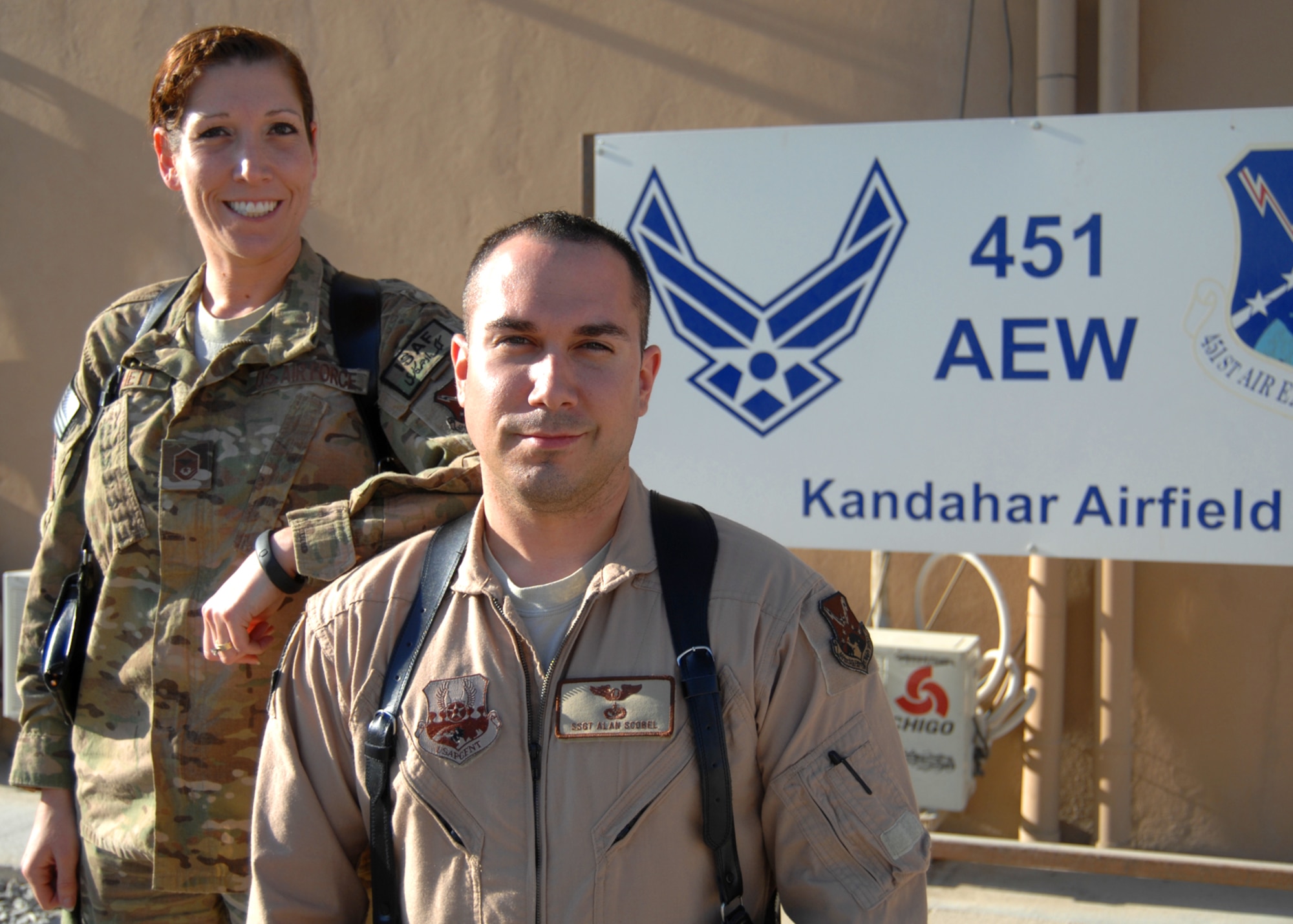 U.S. Air Force Master Sgt. Tracy Bennett, 451st Expeditionary Force Support Flight and Staff Sgt. Alan Scobel, 62nd Expeditionary Reconnaissance Squadron, brother and sister, were reunited while deployed to Kandahar Airfield. They're common bond as Airmen has helped them grow closure as siblings during the course of their careers. (U.S. Air Force photo/Master Sgt. Russell Martin)
