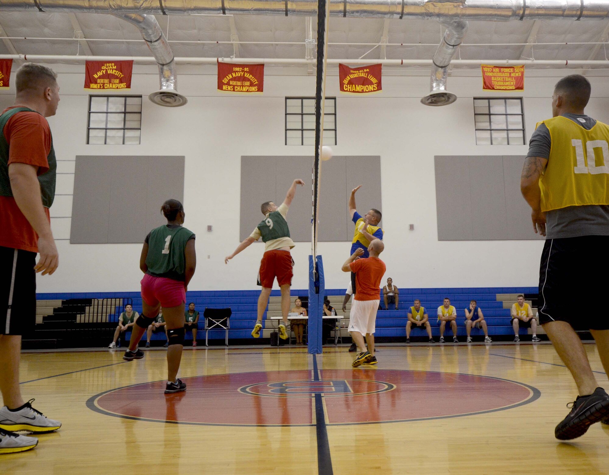 ANDERSEN AIR FORCE BASE, Guam— Members of the 96th Expeditionary Bomb Squadron and the 36th Expeditionary Aircraft Maintenance Squadron play against each other in an intramural volleyball game here, Nov. 15. Permanent party members, deployed members, Air National Guard members, civilians and spouses all participate to make up the 16 teams in the league.  (U.S. Air Force photo by Senior Airman Benjamin Wiseman/Released)