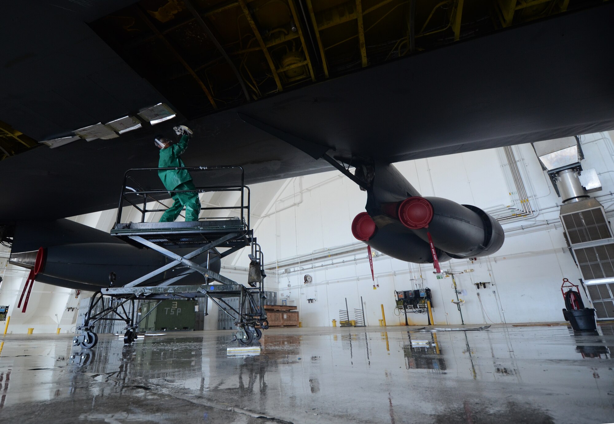 ANDERSEN AIR FORCE BASE, Guam— Airman 1st Class Alexander Maloney, 96th Expeditionary Aircraft Maintenance Unit instrument and flight control technician, applies soap to the wing of a B-52 Stratofortress here, Nov. 15. Washing the aircraft every 30 days assists in controlling corrosion created by Guam’s environment. (U.S. Air Force photo by Senior Airman Benjamin Wiseman/Released)