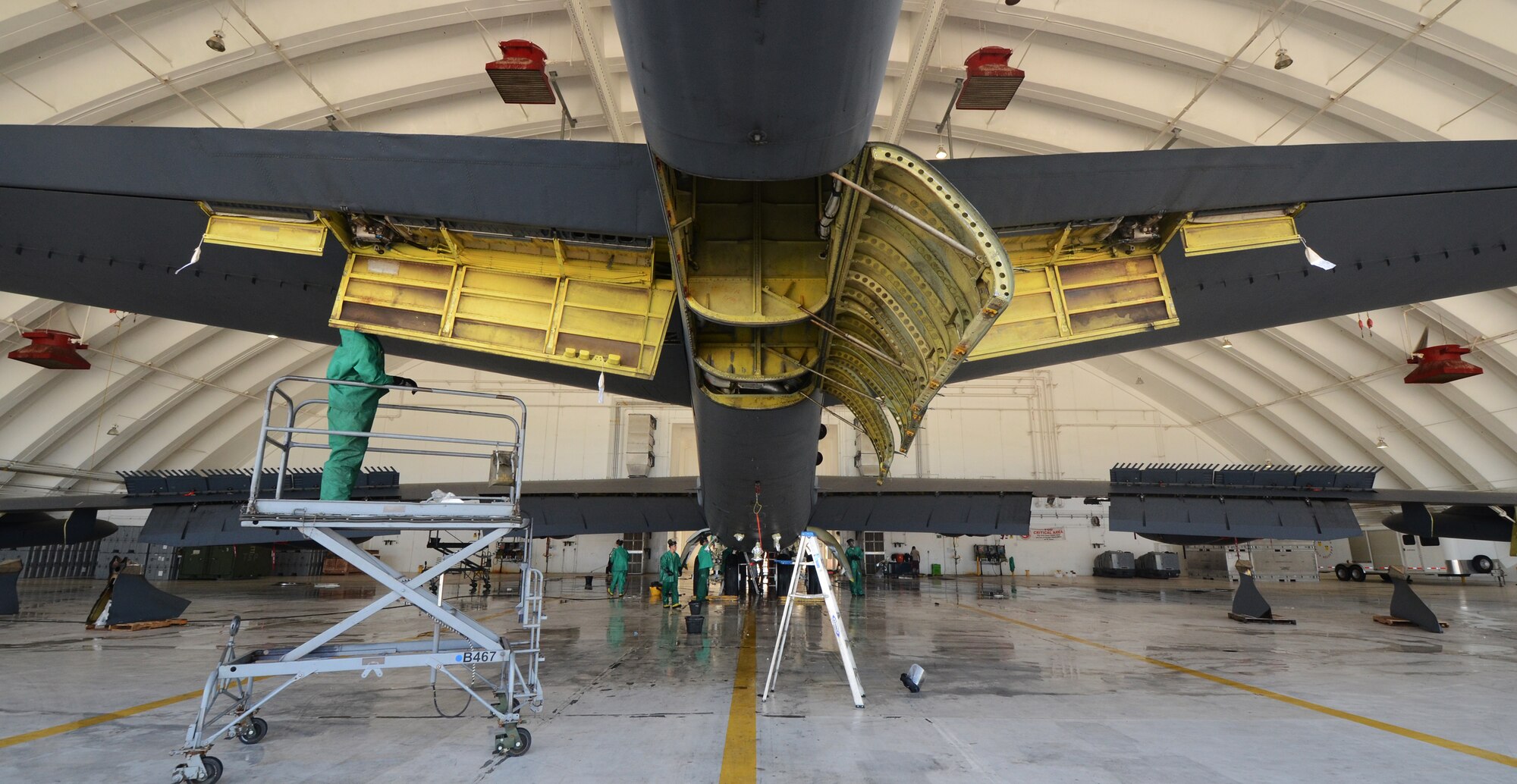 ANDERSEN AIR FORCE BASE, Guam— Members of the 96th Expeditionary Aircraft Maintenance Squadron clean the interior and exterior of a B-52 Stratofortress here, Nov. 15. Wash teams worked 12-hour shifts for two days to ensure the entire aircraft is cleaned and lubricated before returning to flying operations. (U.S. Air Force photo by Senior Airman Benjamin Wiseman/Released)