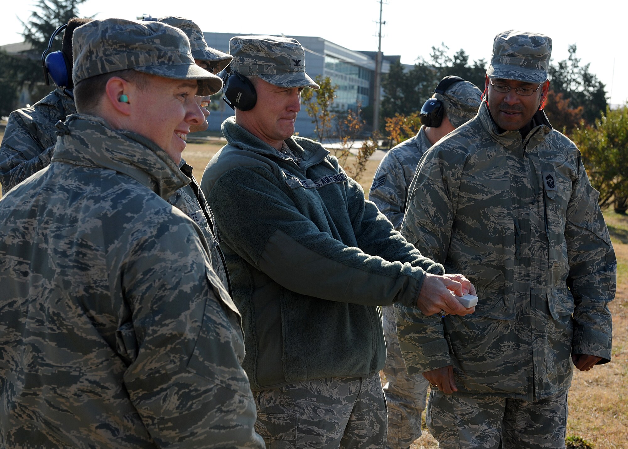 Col. John Pearse, 8th Fighter Wing commander, sets off a ground-blast simulator during a demonstration on Kunsan Air Base, Republic of Korea, Nov. 15, 2012. Pearse was receiving a demonstration on the 8th FW’s two new GBS that are cheaper and safer to operate and will be used during exercises to simulate mortar and rocket attacks. (U.S. Air Force photo/Staff Sgt. Jonathan Fowler)