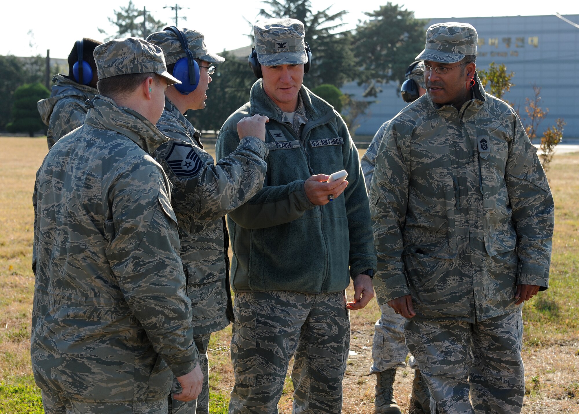 Master Sgt. Todd Cate, 8th Fighter Wing  inspector general’s officer, explains to Col. John Pearse, 8th FW commander, and Chief Master Sgt. Phillip Robinson, 8th FW command chief, how the new ground-blast simulators work during a demonstration on Kunsan Air Base, Republic of Korea, Nov. 15, 2012. The 8th FW recently purchased two new GBS that are cheaper and safer to operate then the older GBS. (U.S. Air Force photo/Staff Sgt. Jonathan Fowler)