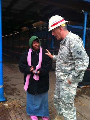 FAR ROCKAWAY, N.Y. – Col. Paul Olsen assures a local resident at the Redfern Housing Complex that the Corps of Engineers is working with local and state authorities to get power restored to the complex as quickly as possible. The area was inundated by saltwater during Hurricane Sandy and lost power as a result. USACE is actively supporting emergency temporary power missions in New York and New Jersey and is ready to provide emergency temporary power with more than 294 generators staged at forward locations. This mission assignment includes hauling, installing, operating and maintaining generators at critical facilities. (U.S. Army photo)