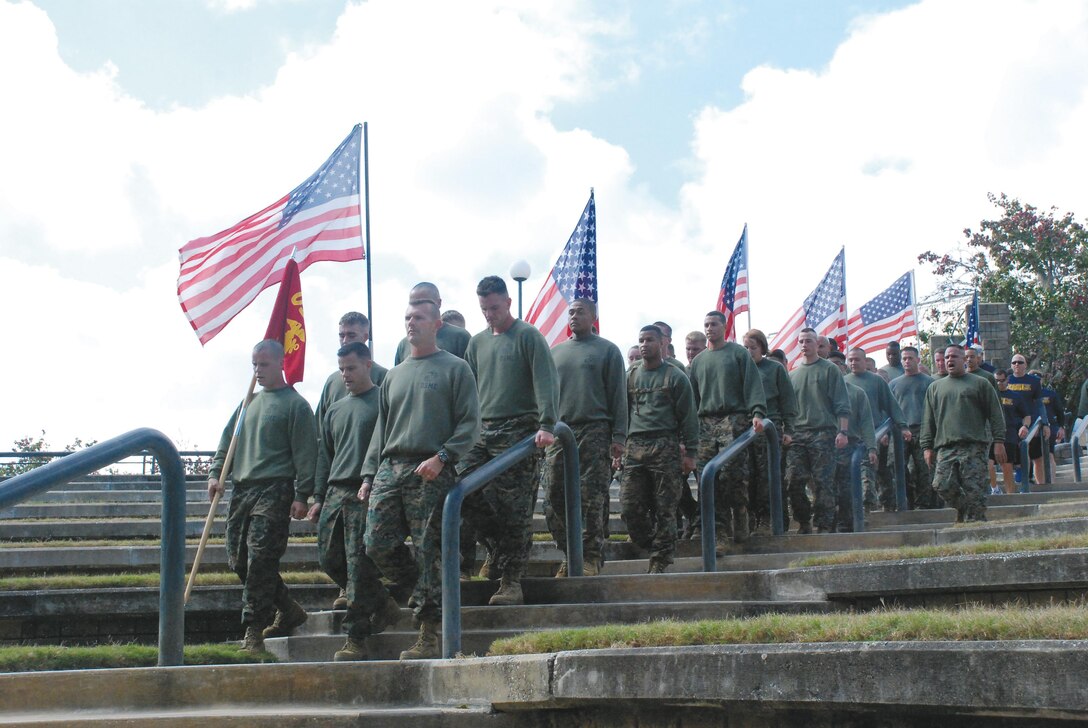 More than 35 Marines from Marine Depot Maintenance Command, Marine Corps Logistics Command and Marine Corps Logistics Base Albany march into the Albany Veterans Park Amphitheater after participating in the 8th annual Operation One Voice run.
